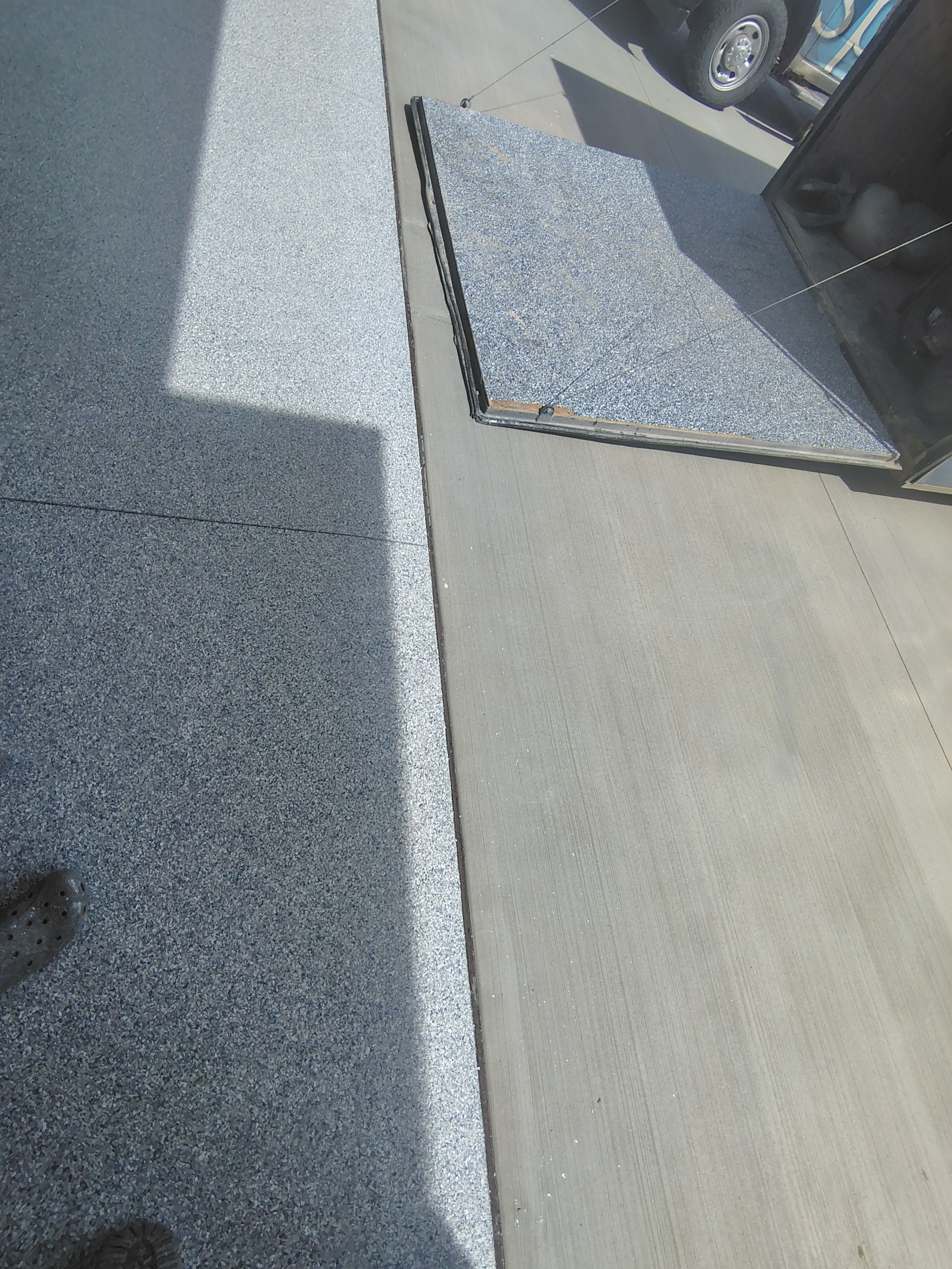 Sioux Falls Garage Floor Transformation with Gray Decorative Flake Coating by Select Painting, Coatings & Garage Cabinets