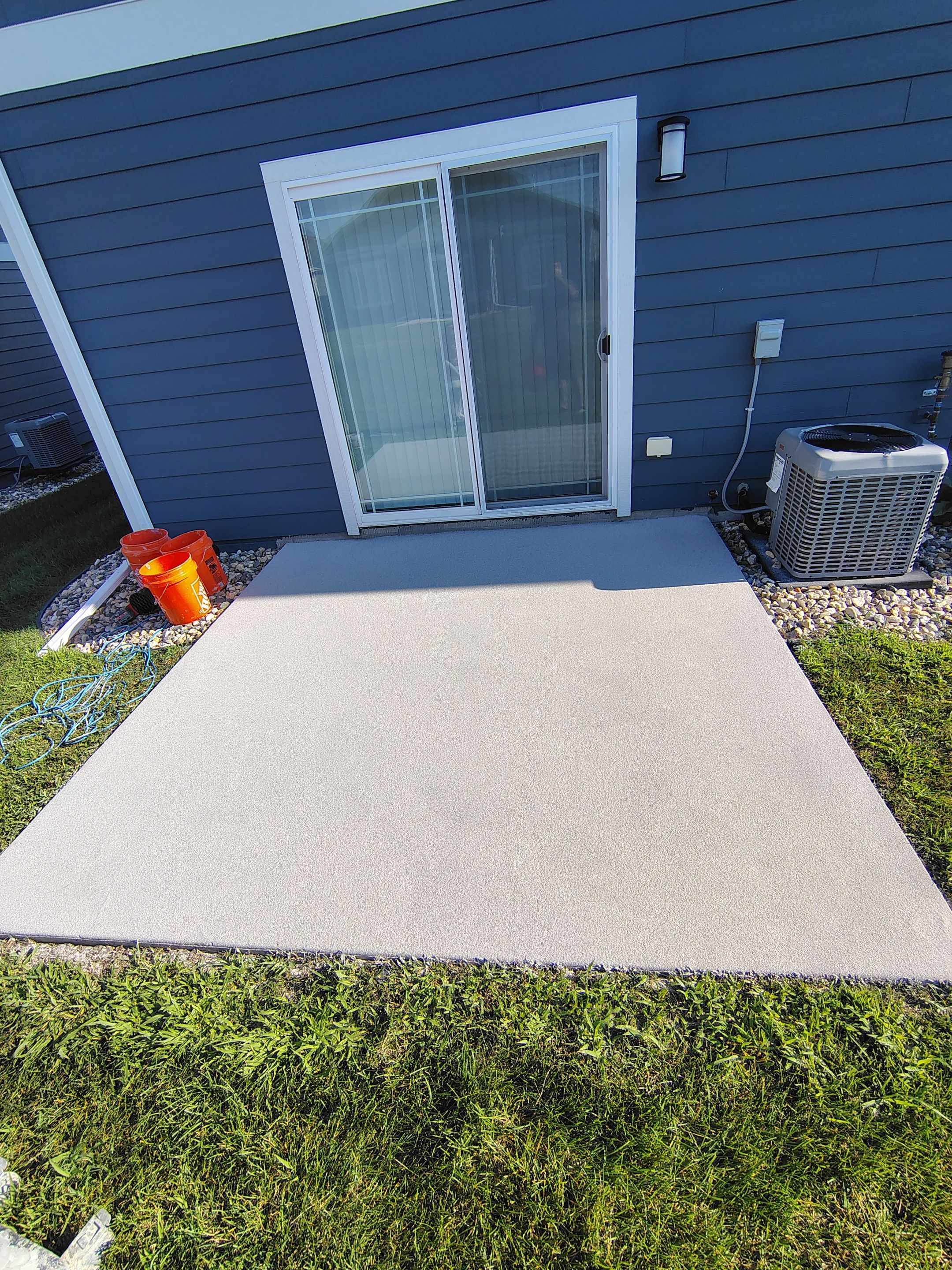 Custom Epoxy Garage Floor and Patio Coating in Sioux Falls by Select Painting, Coatings & Garage Cabinets