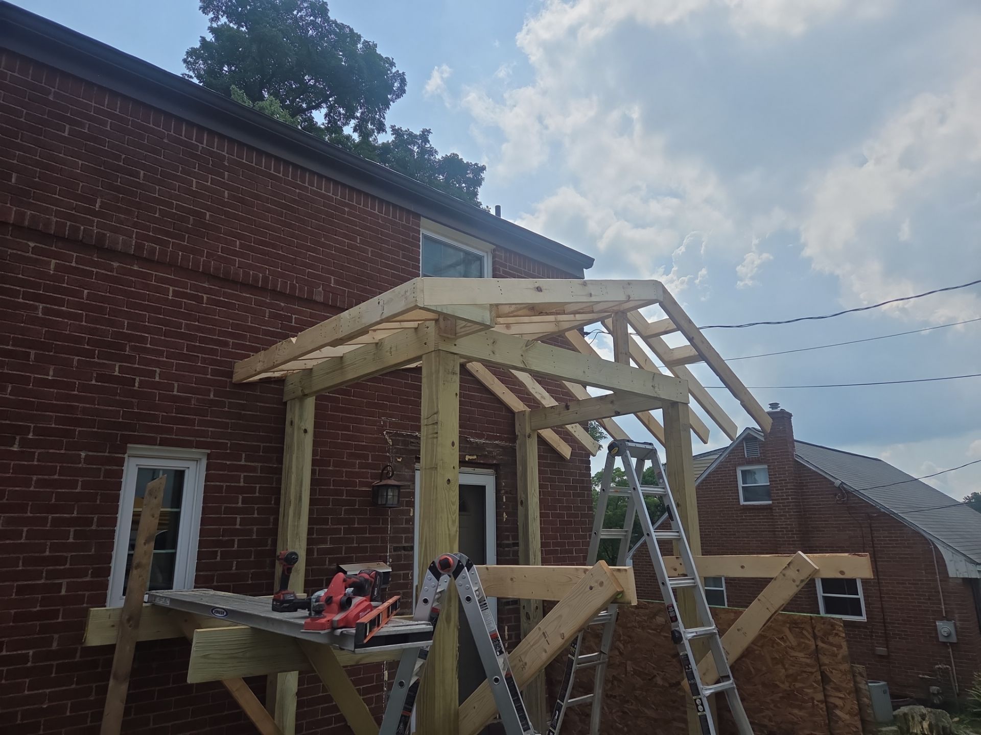 Concret and roof build  by Cousins Roofing Siding & Decks
