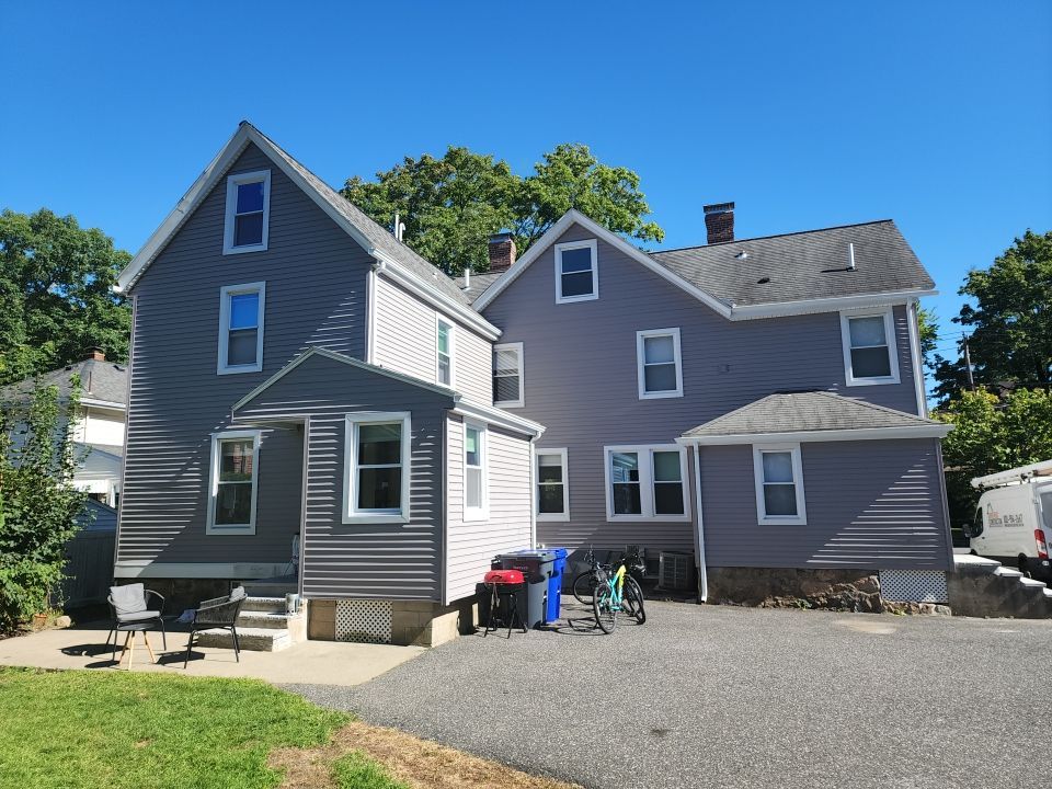 Vinyl siding layover project for 2 family in Wellesley, MA by UBrothers Construction