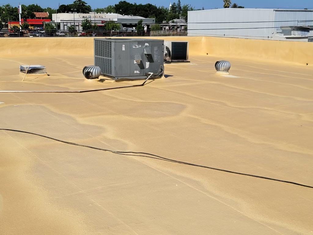 Spray foam and coatings using Conklin Benchmark/PUMA XL coatings and spray foam by Straight Edge Roofing Inc