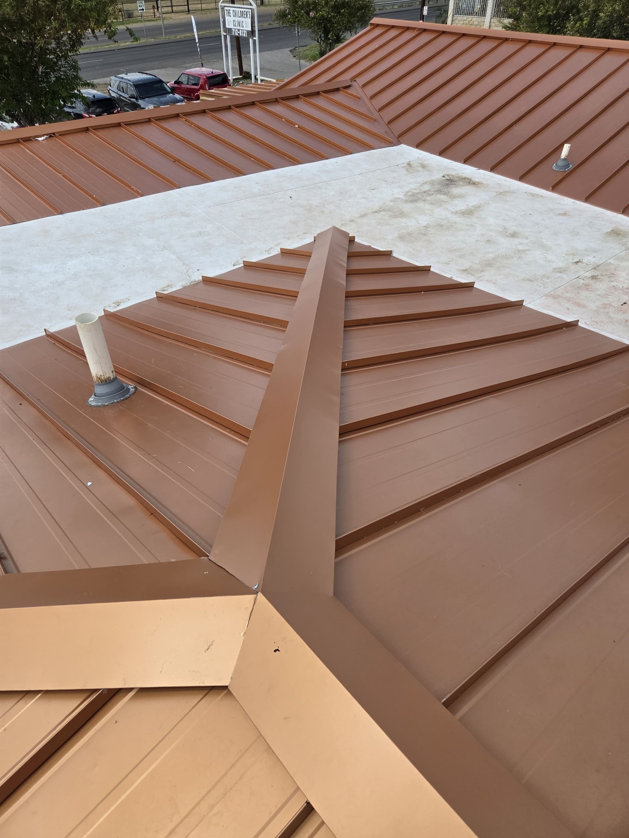 Copper Standing Seam Metal Roof Installation for Laredo Medical Clinic by JM Flores Roofing & Construction, Inc