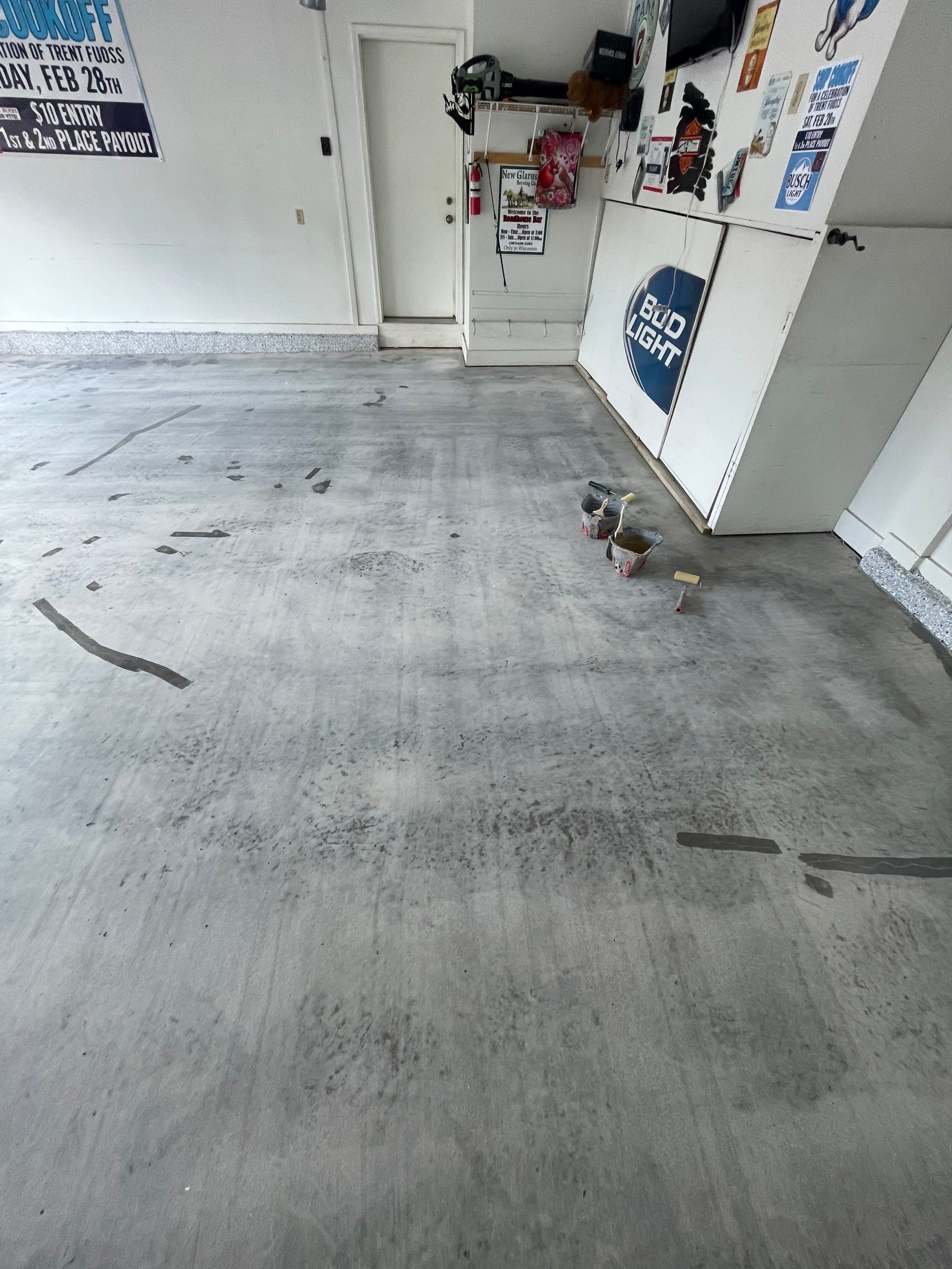 Residential Garage Floor Coating with Feather Grey Finish in Sioux Falls by Select Painting, Coatings & Garage Cabinets