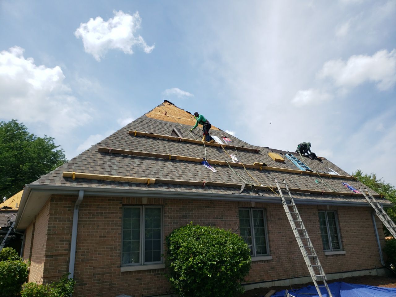Asphalt Roof Replacement and Aluminum Gutter Installment  by Custom Installations