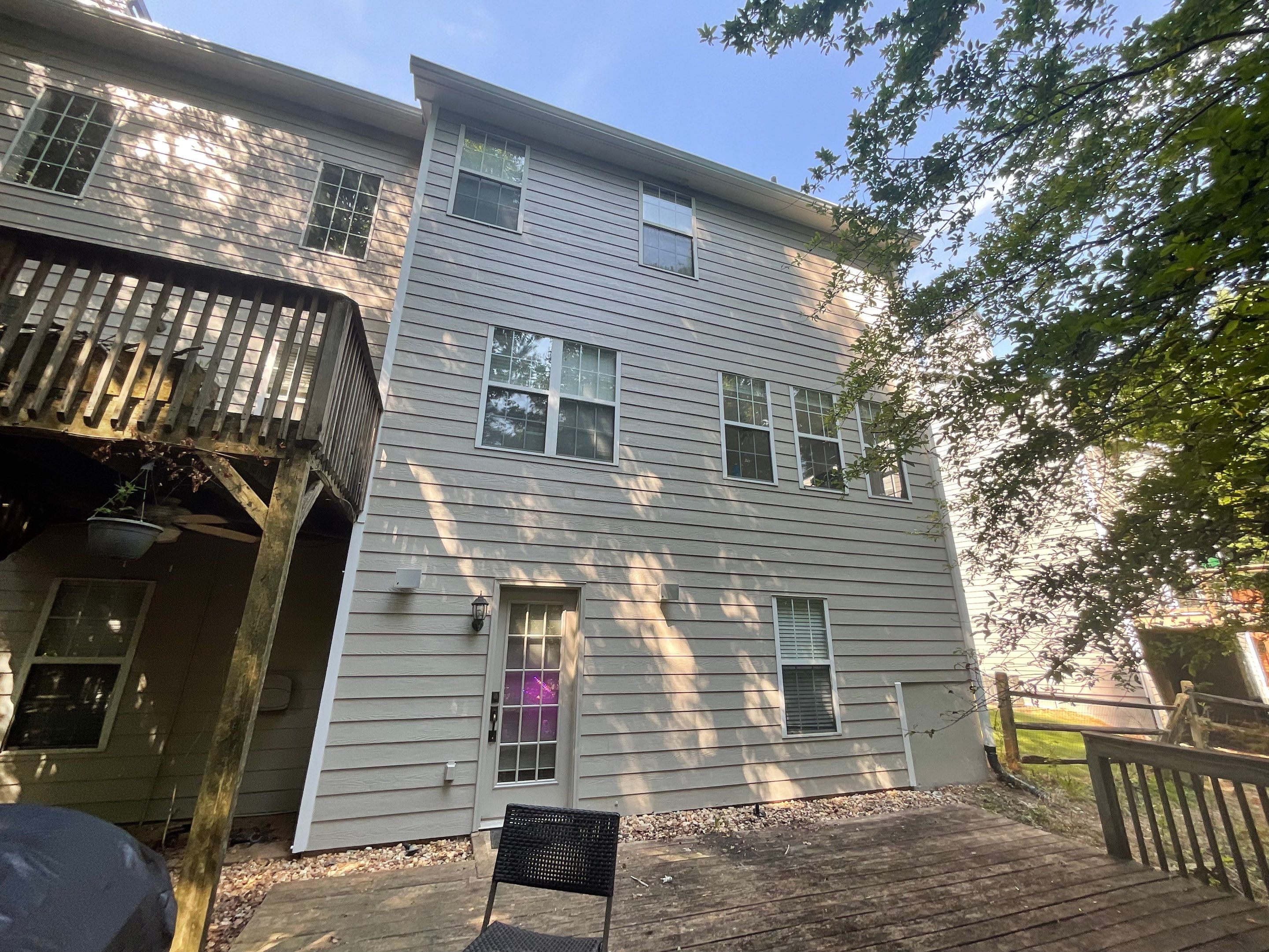 Stucco and Siding Exterior Painting with New Gutters in Kennesaw by Swift Home Renovations