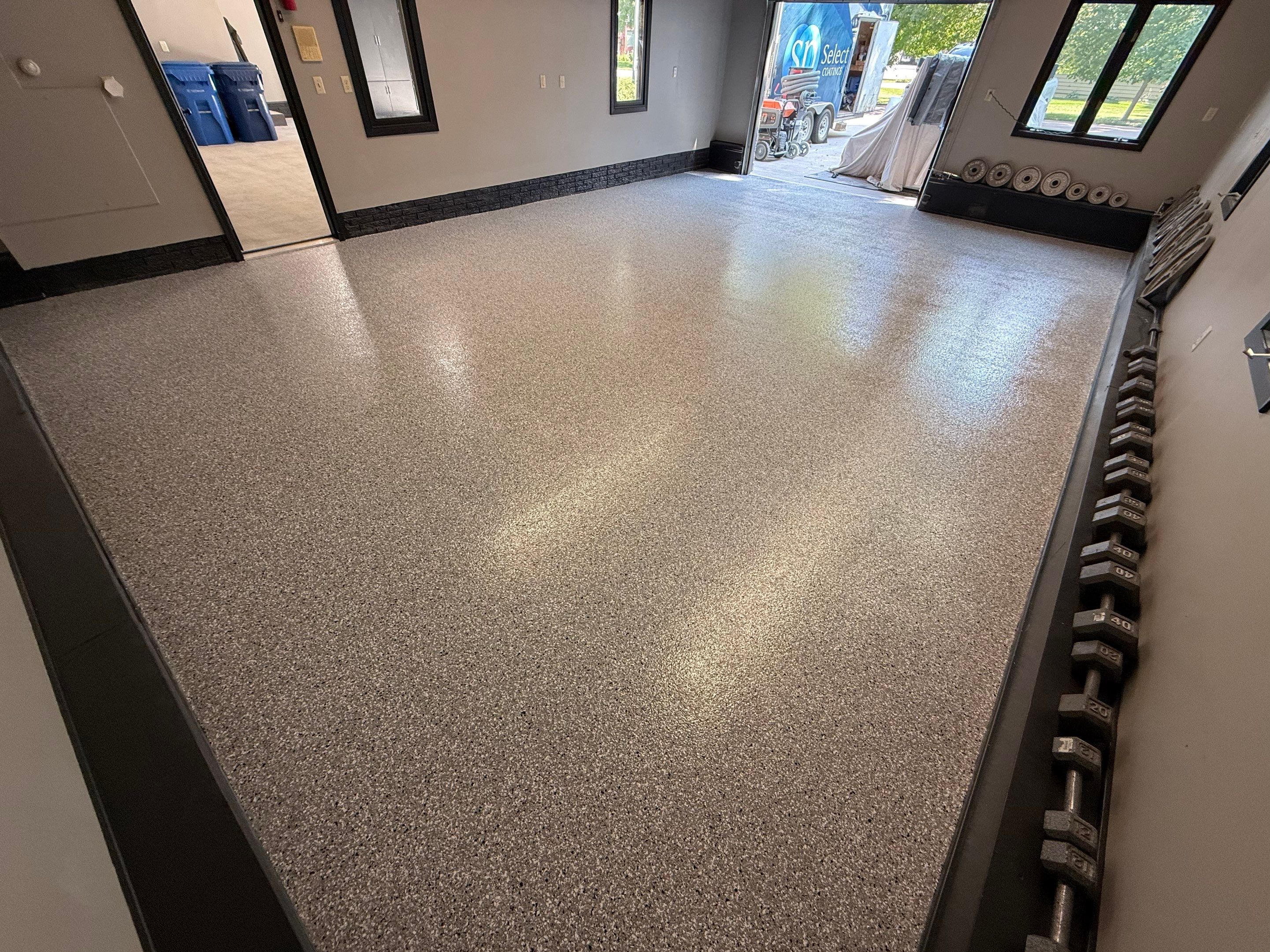 Garage Floor and Textured Pool Deck Coating in Sioux Falls by Select Painting, Coatings & Garage Cabinets