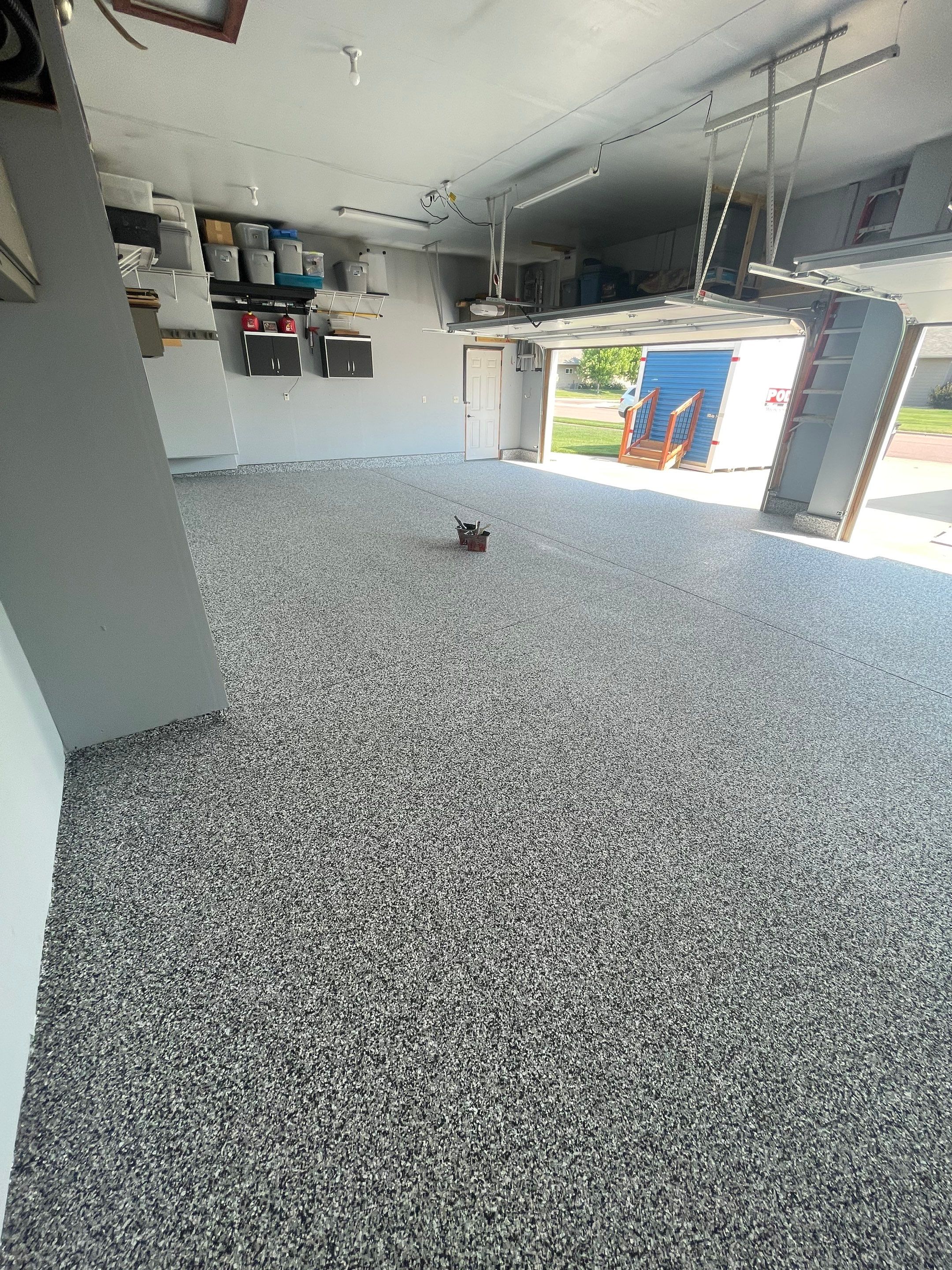 Sioux Falls Garage Concrete Coating Installation with Domino Flake by Select Painting, Coatings & Garage Cabinets
