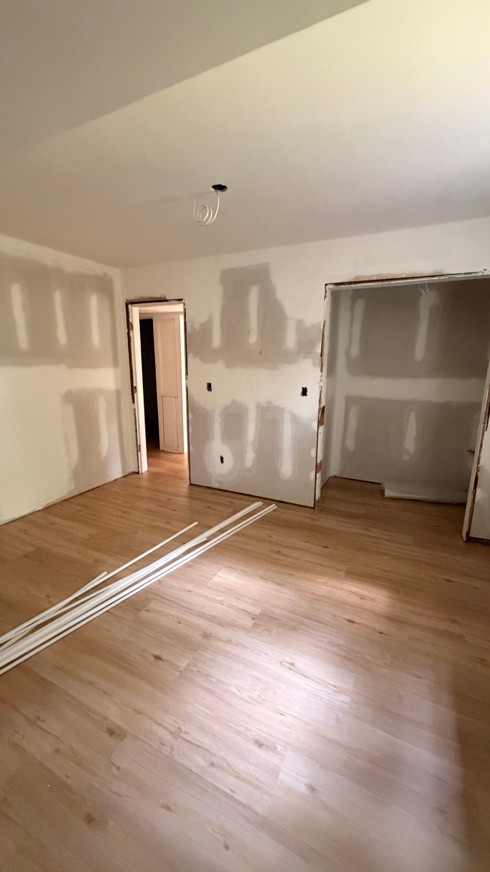 Basement Remodeling with Wood-Look Flooring and Custom Wainscoting in Dunwoody by Swift Home Renovations