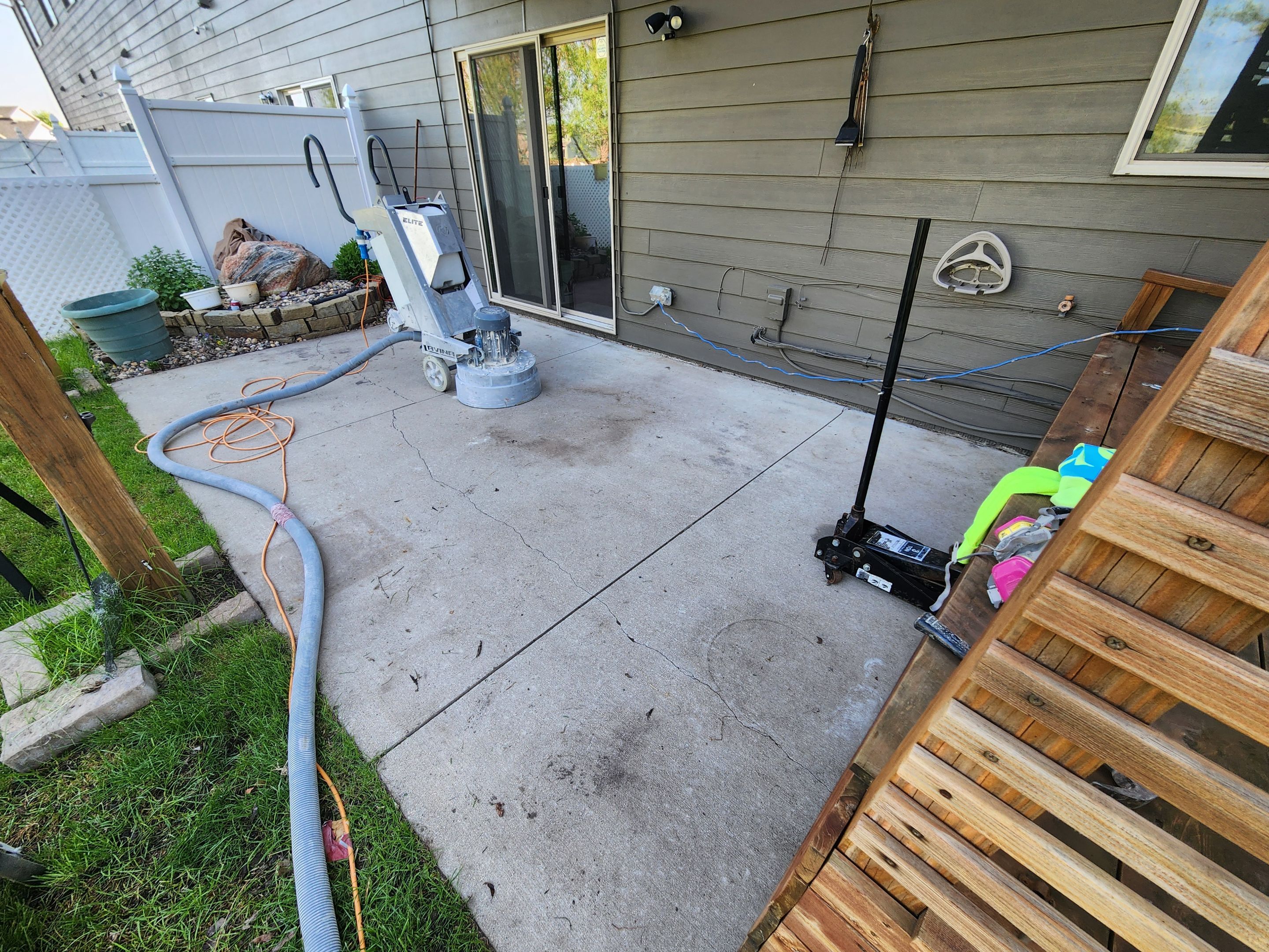 Coyote Flake Concrete Coating for Sioux Falls Patio by Select Painting, Coatings & Garage Cabinets