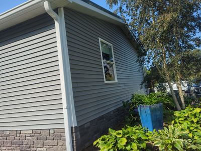 Siding Installation using CertainTeed Monogram Siding and Tando Stone.
