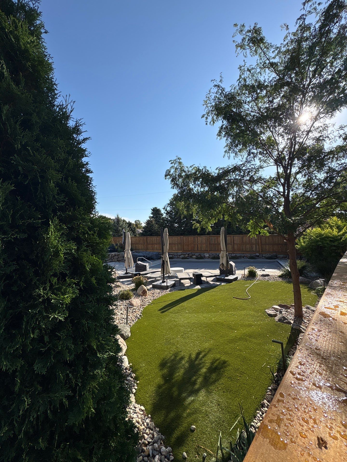 Custom Privacy Fence and Paver Patio Installation in Sioux Falls by Select Painting, Coatings & Garage Cabinets