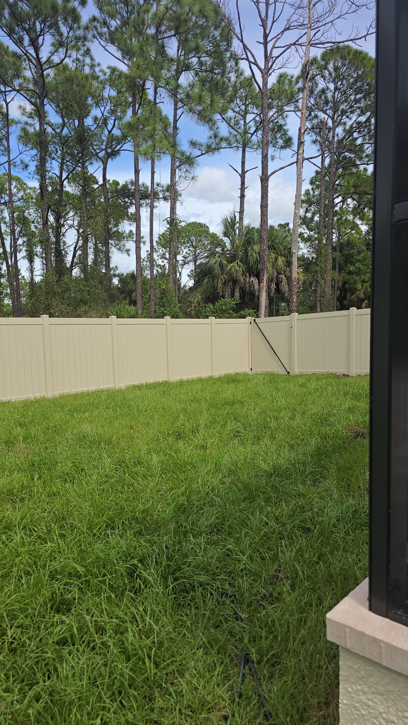 Tan Vinyl Privacy Fence and Gate Installation in Port Charlotte by True Fence LLC