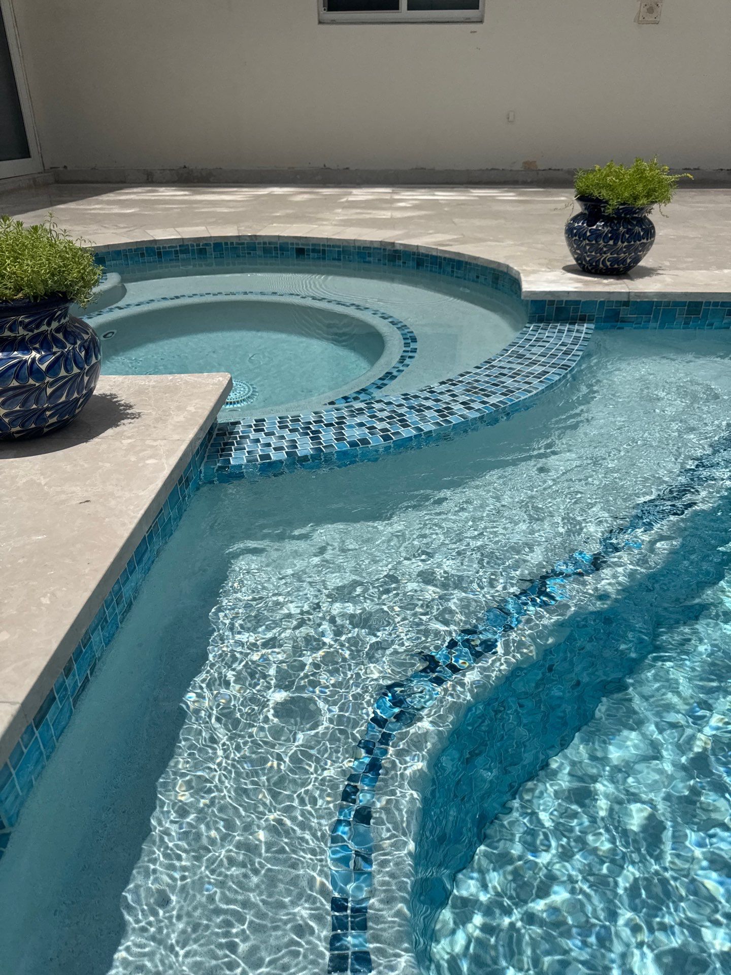 Watefall and bench addition by Pristine Pools Miami