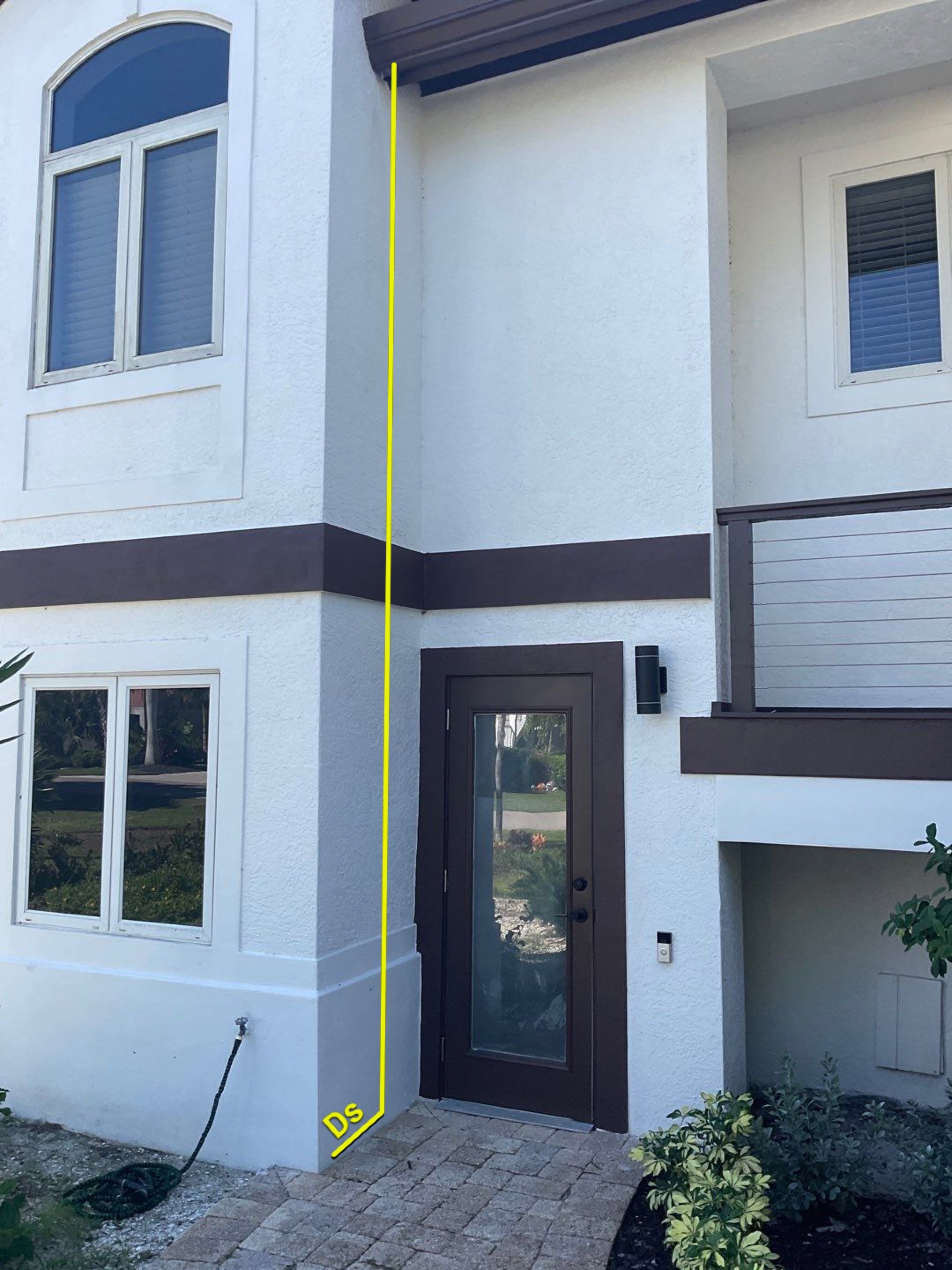 Musket Brown 7-Inch Gutters and White Down Spouts in Sanibel FL by Gutter Professors