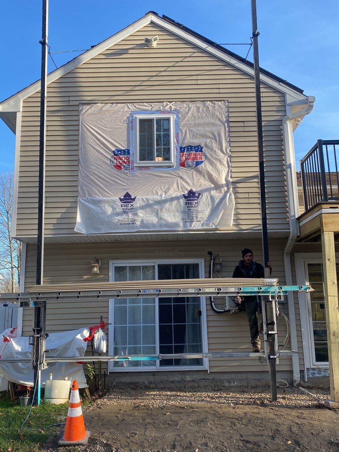 Siding Repair using Certainteed Mainsteet D4 and EPDM roof under deck by A Plus Exterior