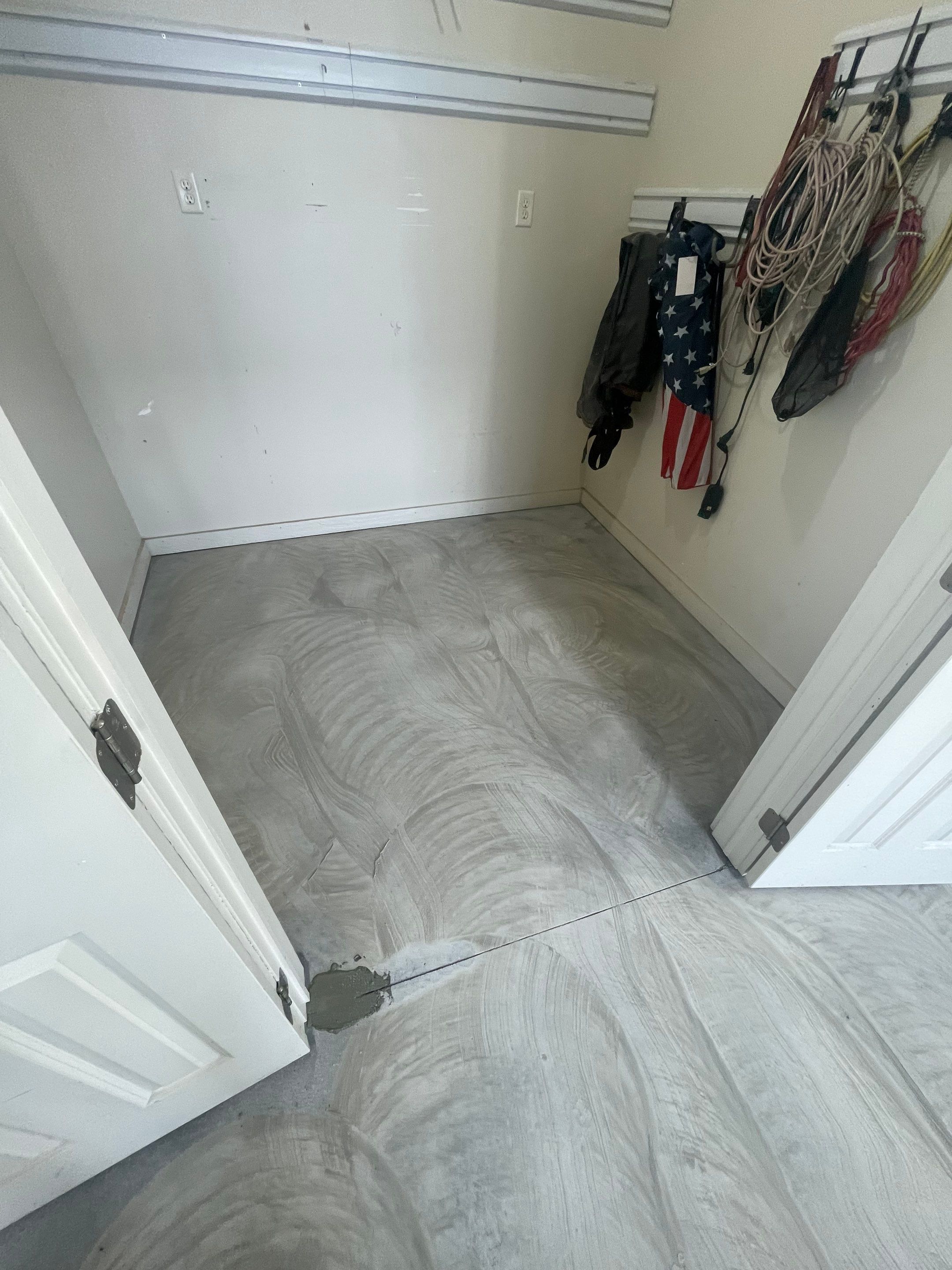 Coyote Flake Garage Floor Coating in Sioux Falls with Trench Drain by Select Painting, Coatings & Garage Cabinets