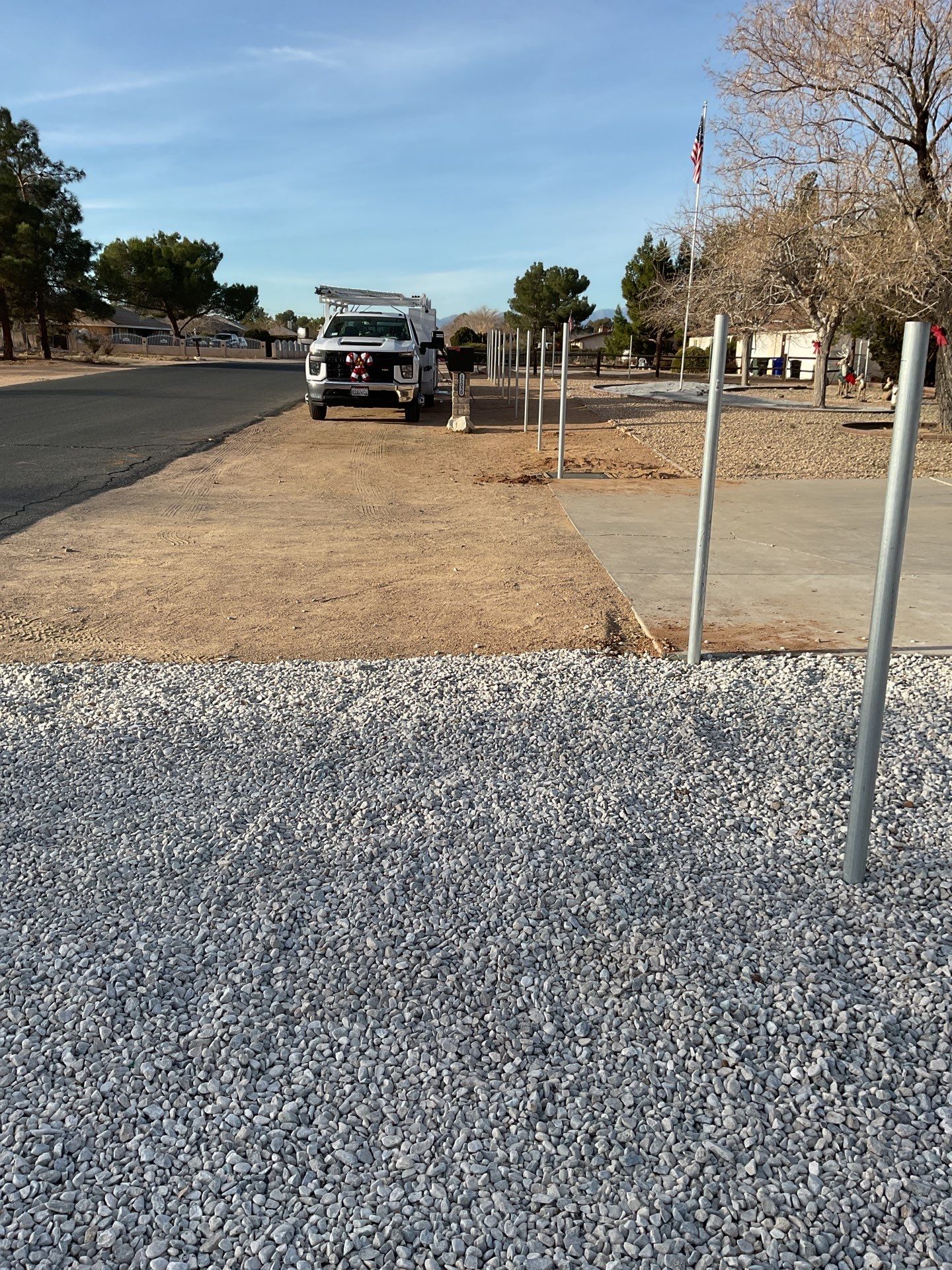 Sleek chain link fence installation with a solar motorized gate by Fence Guys Inc.
