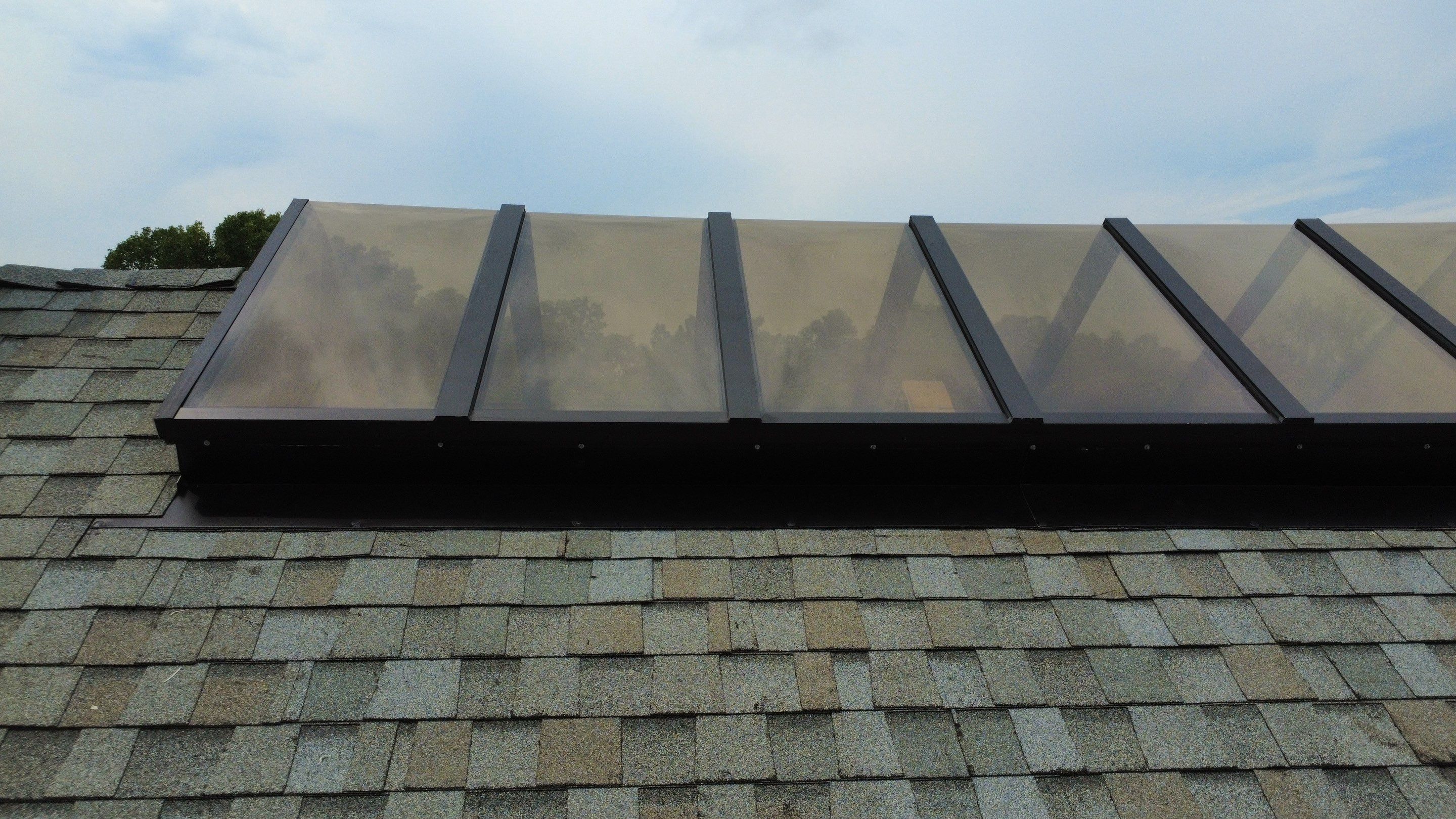 Asphalt Shingle and Skylight Replacement Project in Denver, CO by Blue Peaks Roofing LLC 