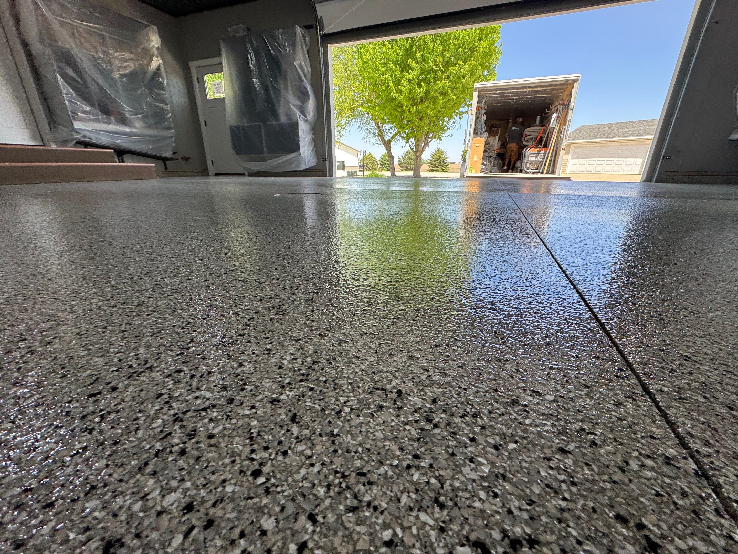 High-Gloss Grey Epoxy Floor Coating for Inwood Garage by Select Painting, Coatings & Garage Cabinets