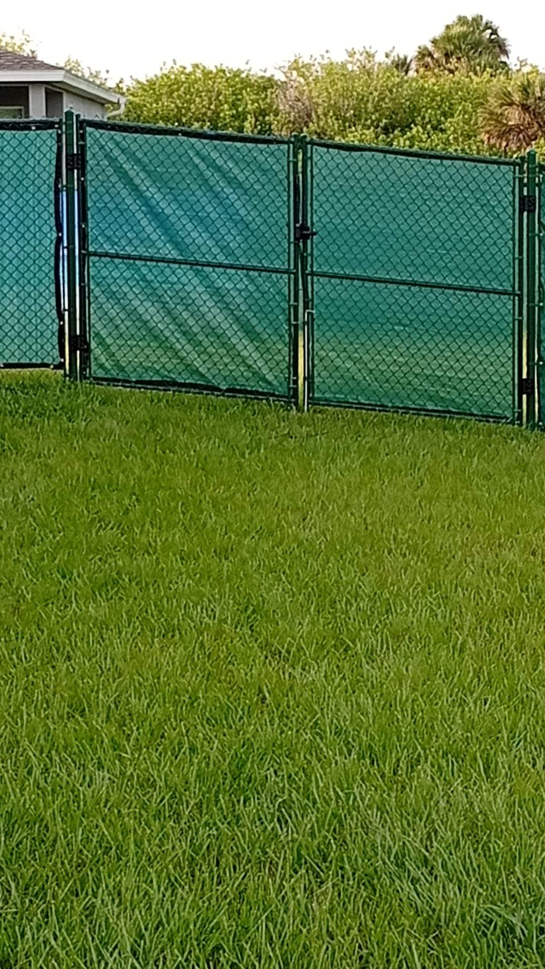 Chain Link Fence Installation with Custom Beach Privacy Screen in Port Charlotte by True Fence LLC