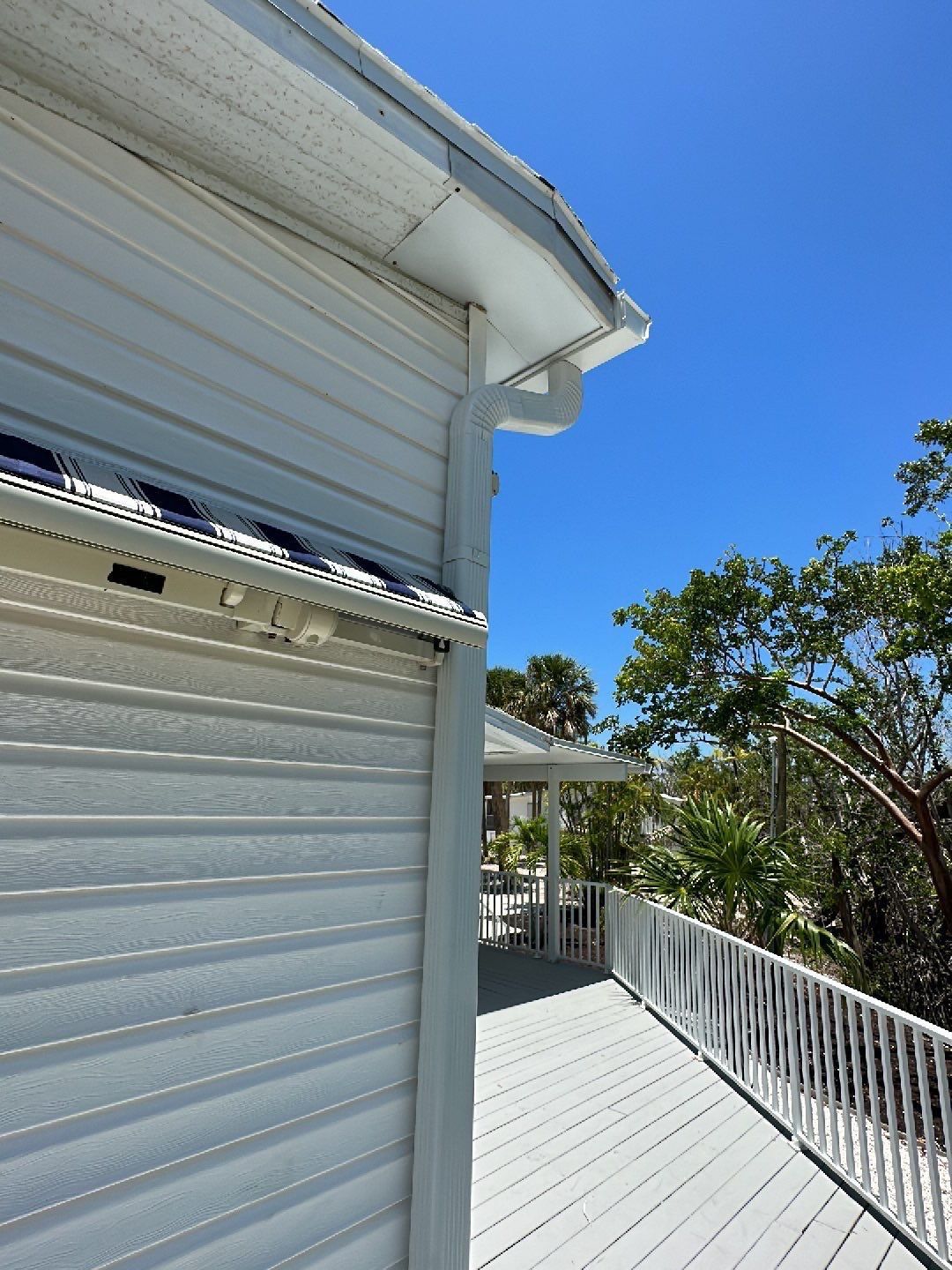 Downspout Installation using Charcoal Grey in Sanibel FL by Gutter Professors