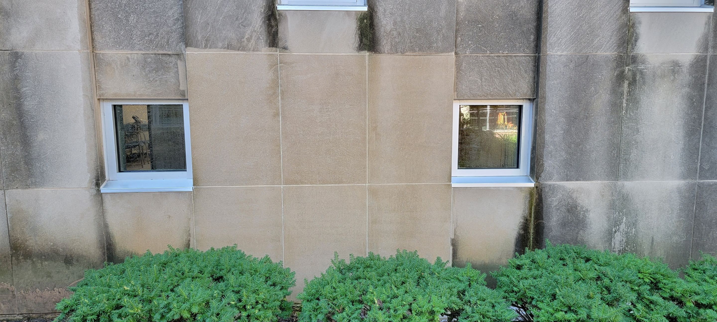 Courtyard pressure washing difficult access.  by Northern Power Washing LLC.