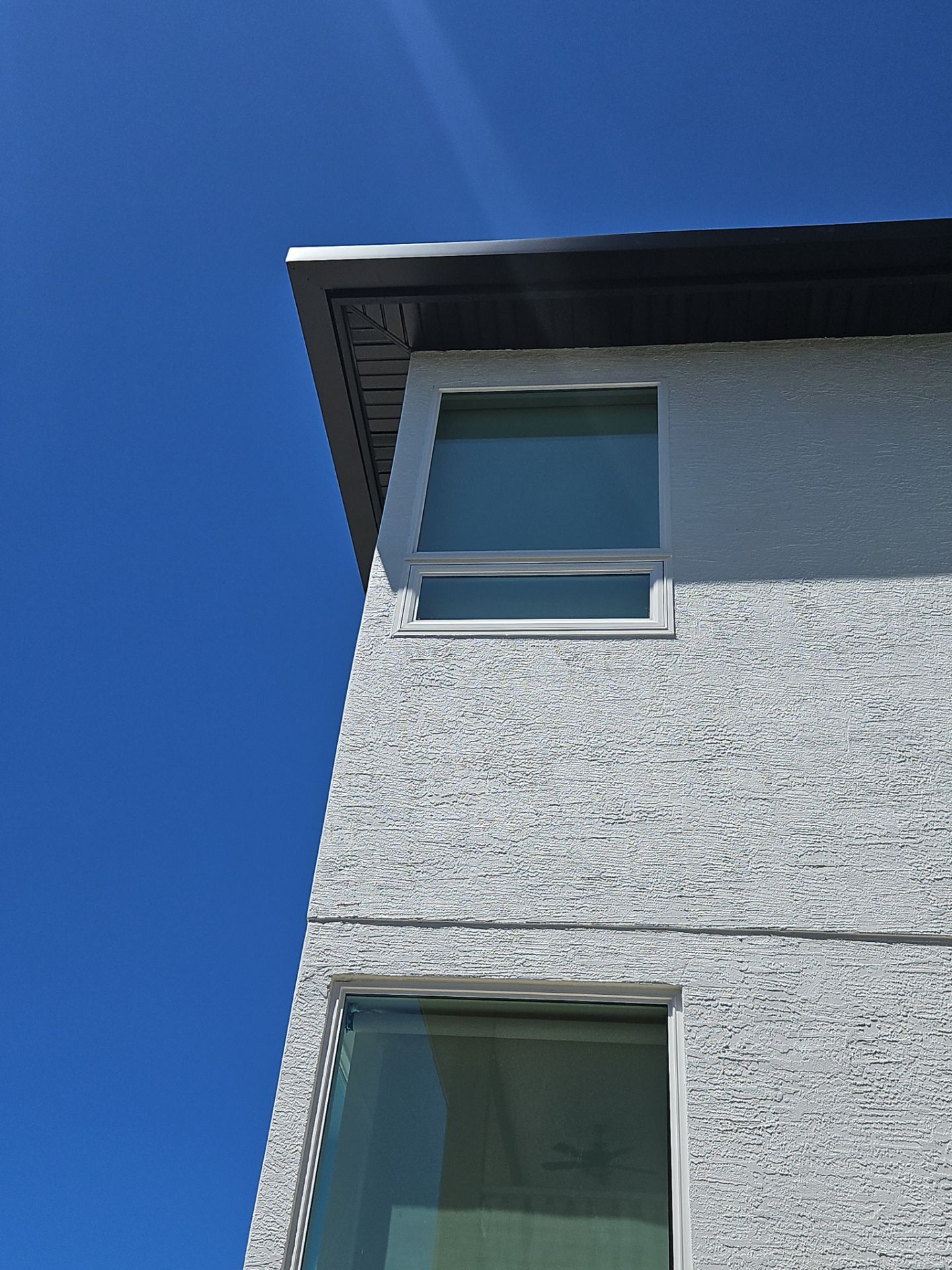 Soffit and Fascia Installation and black seamless gutters in Sarasota FL by Gutter Professors