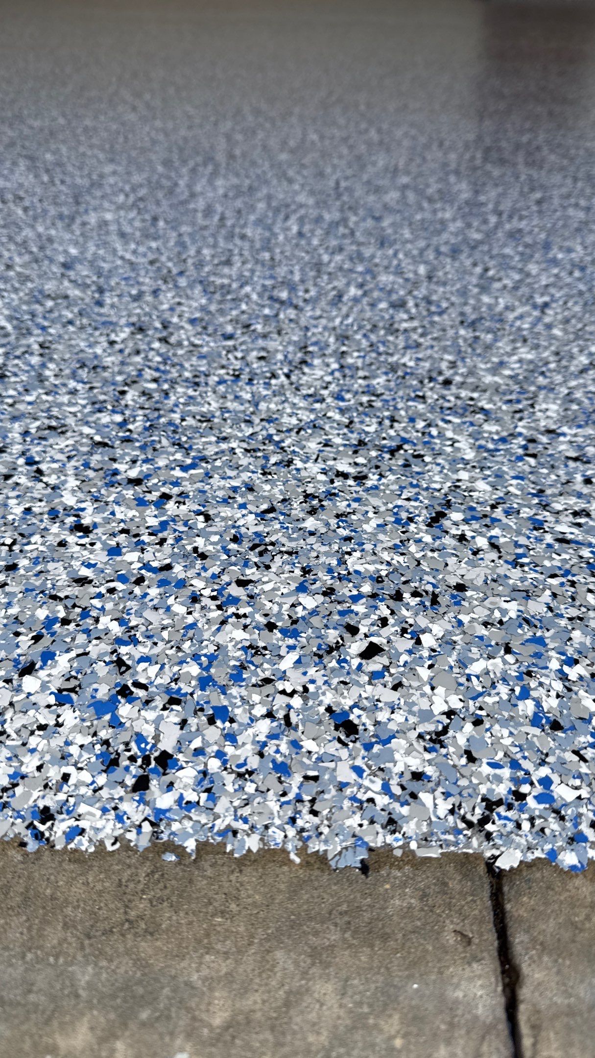 Custom "Comet" Epoxy Garage Floor Renovation in Lawrence by Banner Garage