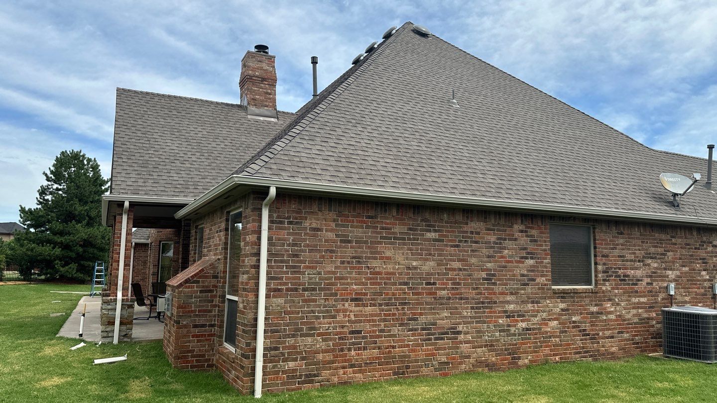 Roof Replacement and Gutter Installation in Edmond, OK by McCann's Roofing and Construction