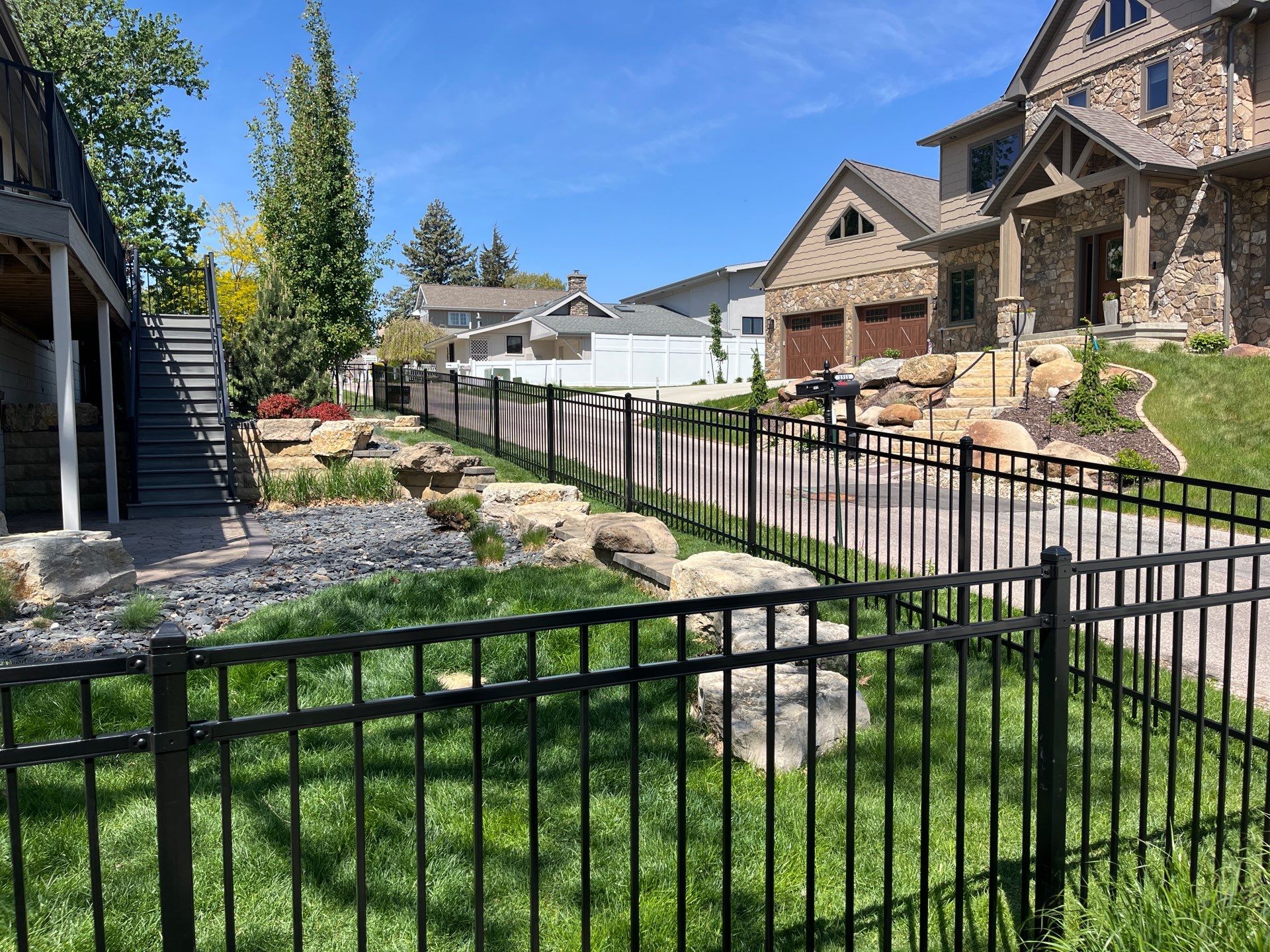 Ornamental Black Metal Picket Fence Installation in Cedar Falls by Perfect Picket Fence and Stain