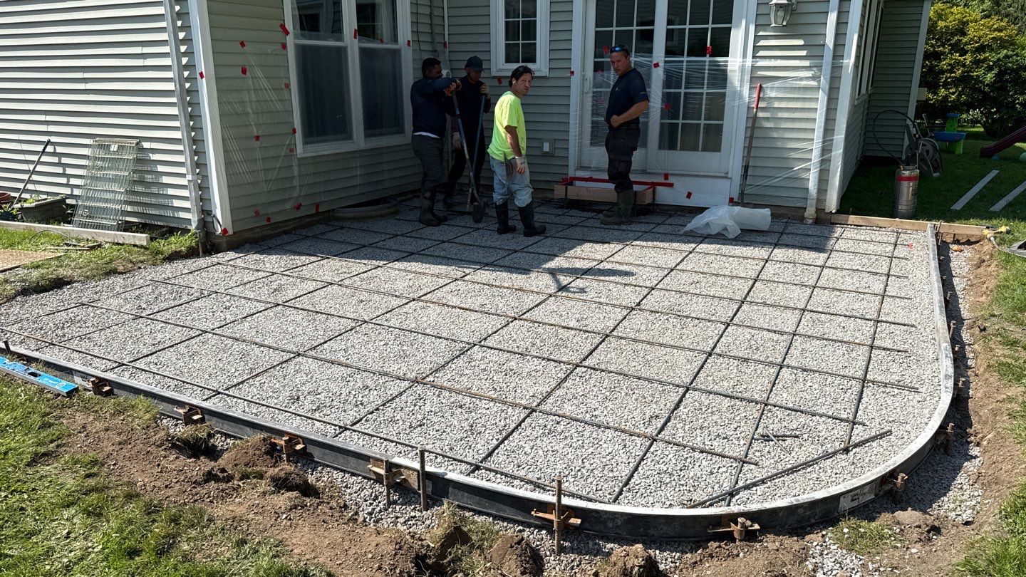 Oxford slate stamped patio  by NG Masonry & Construction LLC