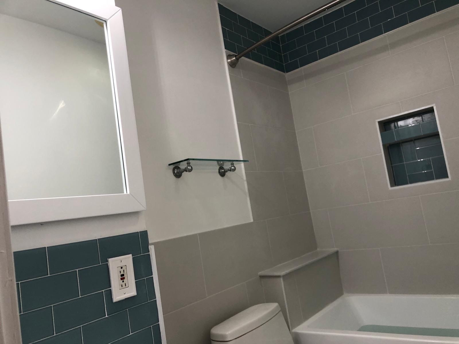 Bathroom Remodel using Tile by Home Concepts Construction