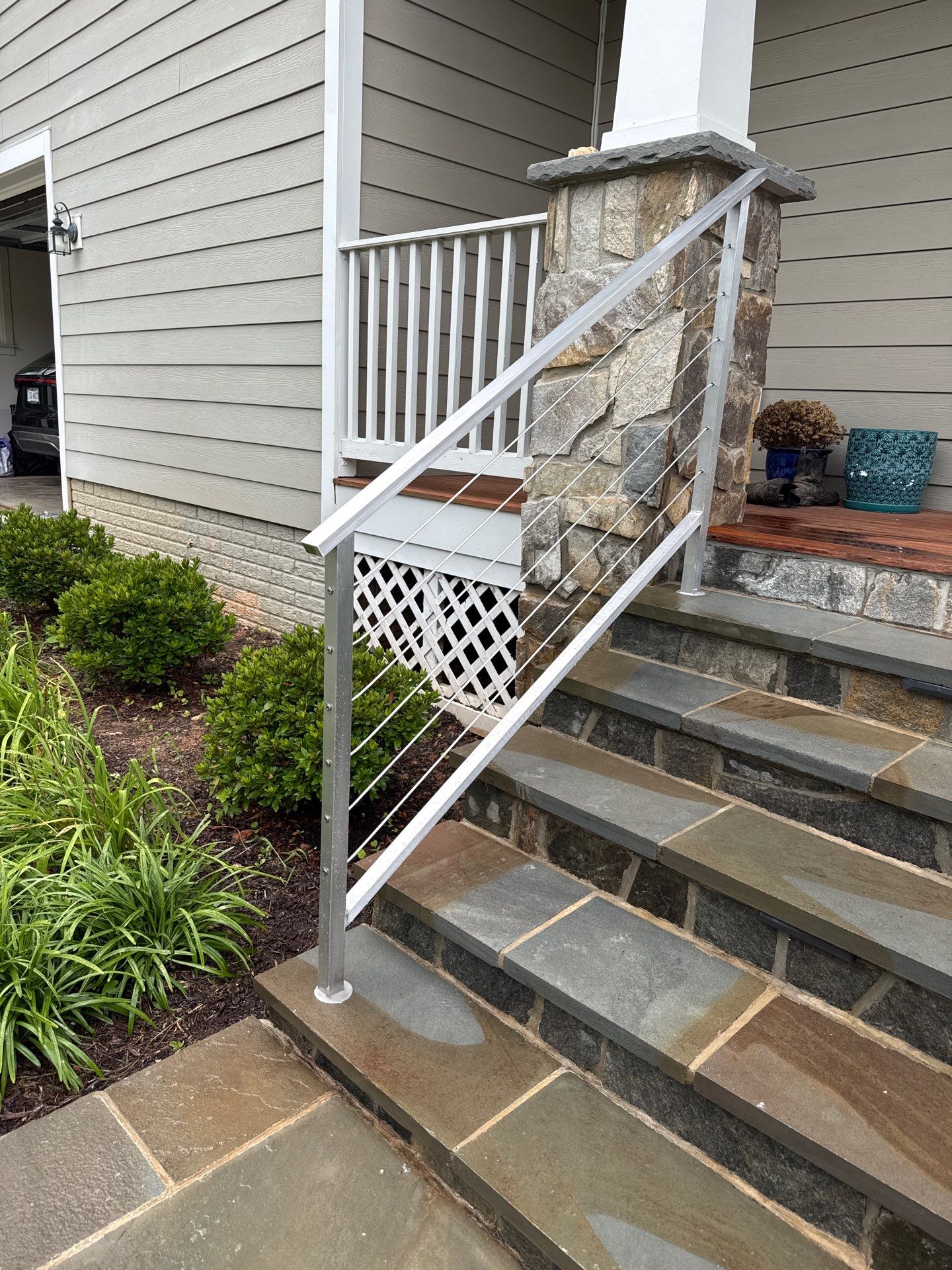 Custom Stone Porch Steps with Modern Cable Railing in Falls Church by Capitol Iron Works