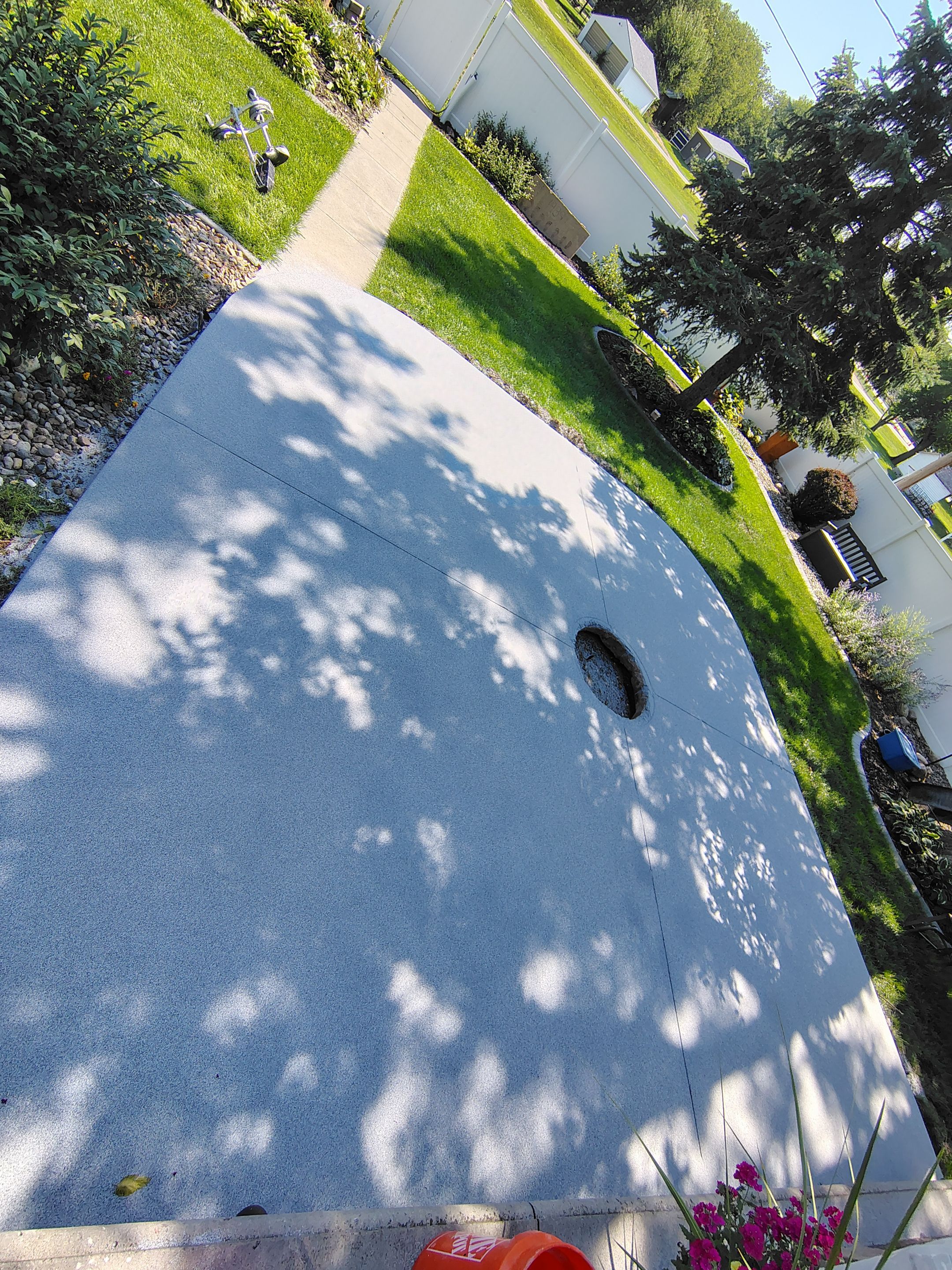 Custom Garage Floor Coating and Backyard Patio Refinishing in Tyndall by Select Painting, Coatings & Garage Cabinets