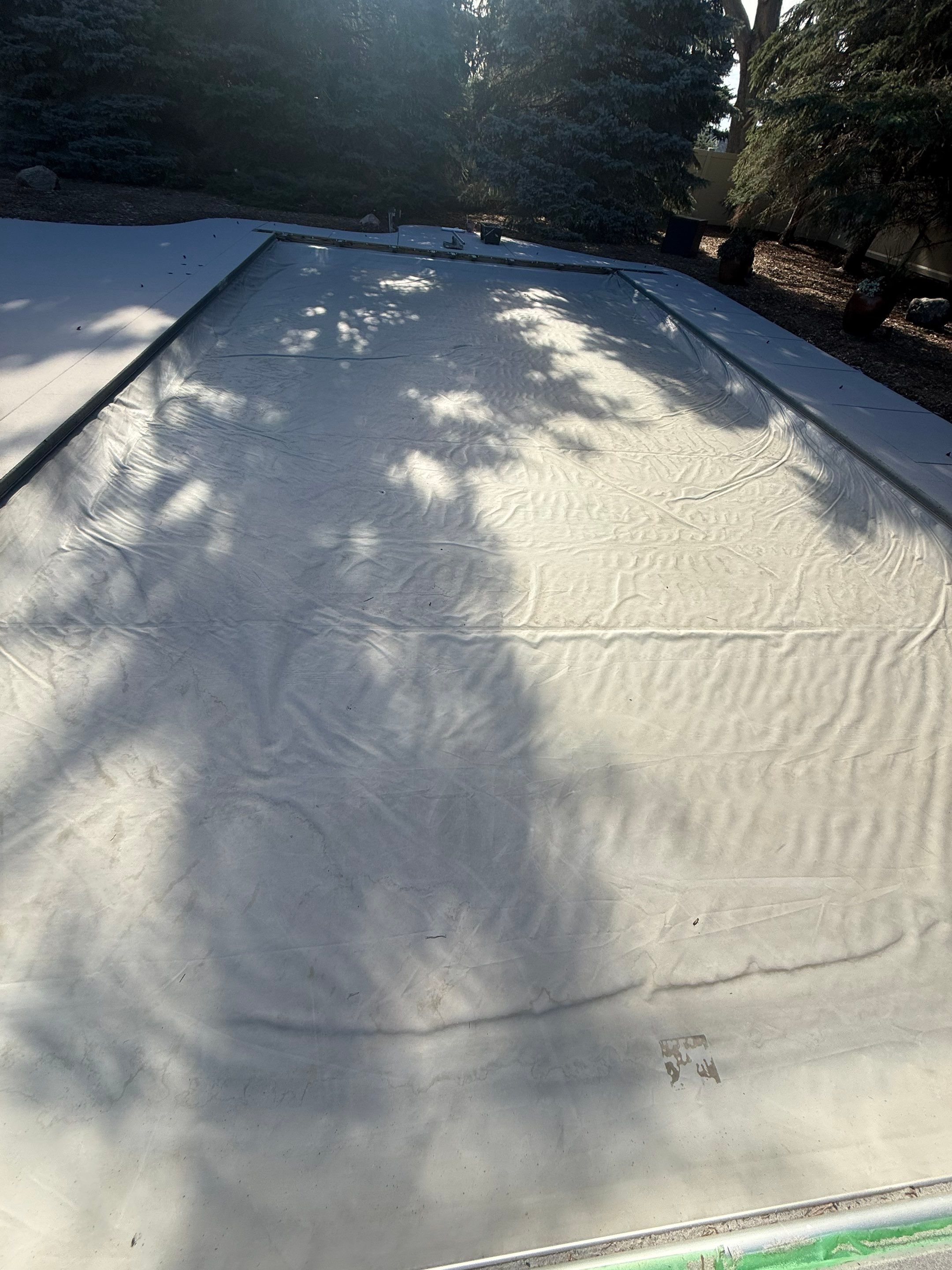 Decorative Concrete Pool Deck and Patio Resurfacing in Sioux Falls by Select Painting, Coatings & Garage Cabinets