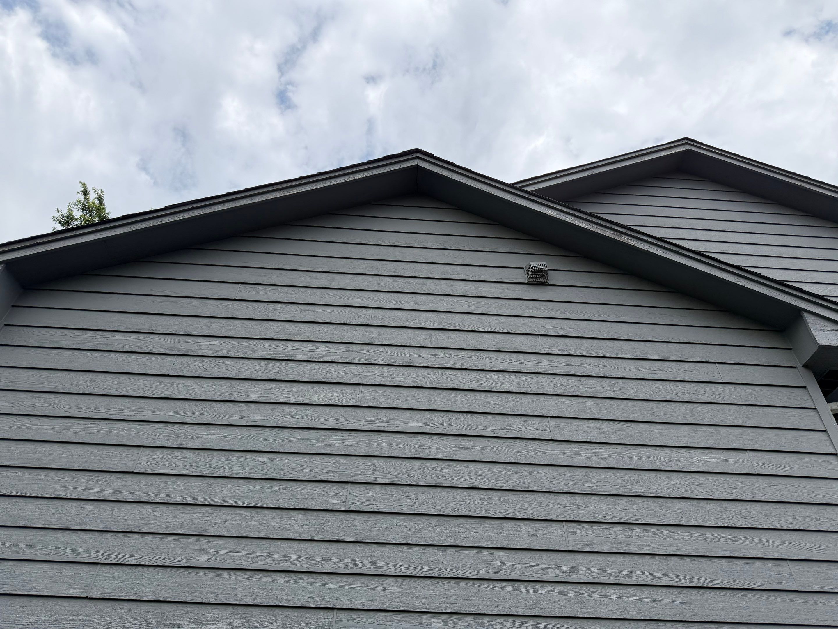 Full Exterior Painting for Gray Siding and Trim in Sioux Falls by Select Painting, Coatings & Garage Cabinets