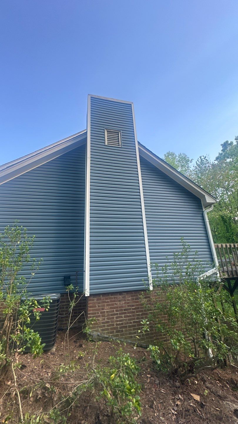 Blue Vinyl Siding Replacement and Exterior Trim Update in Durham by The Remodeling Company