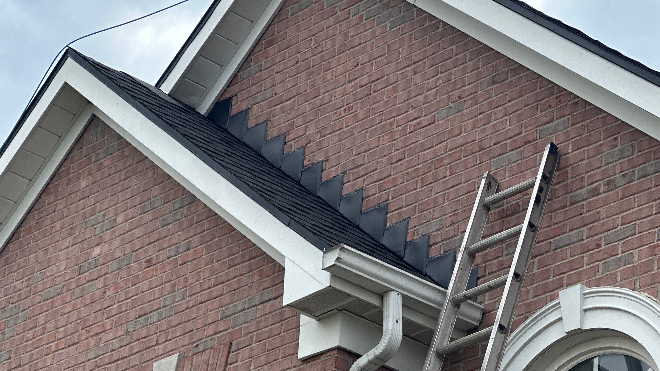 Walden Ponds - Pristine Black and Hydro Flo Gutter Guards by Tamlin Roofing