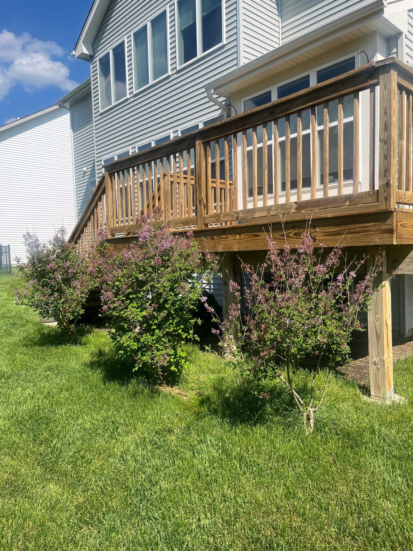 wood deck cleaning and staining by Northern Power Washing LLC.