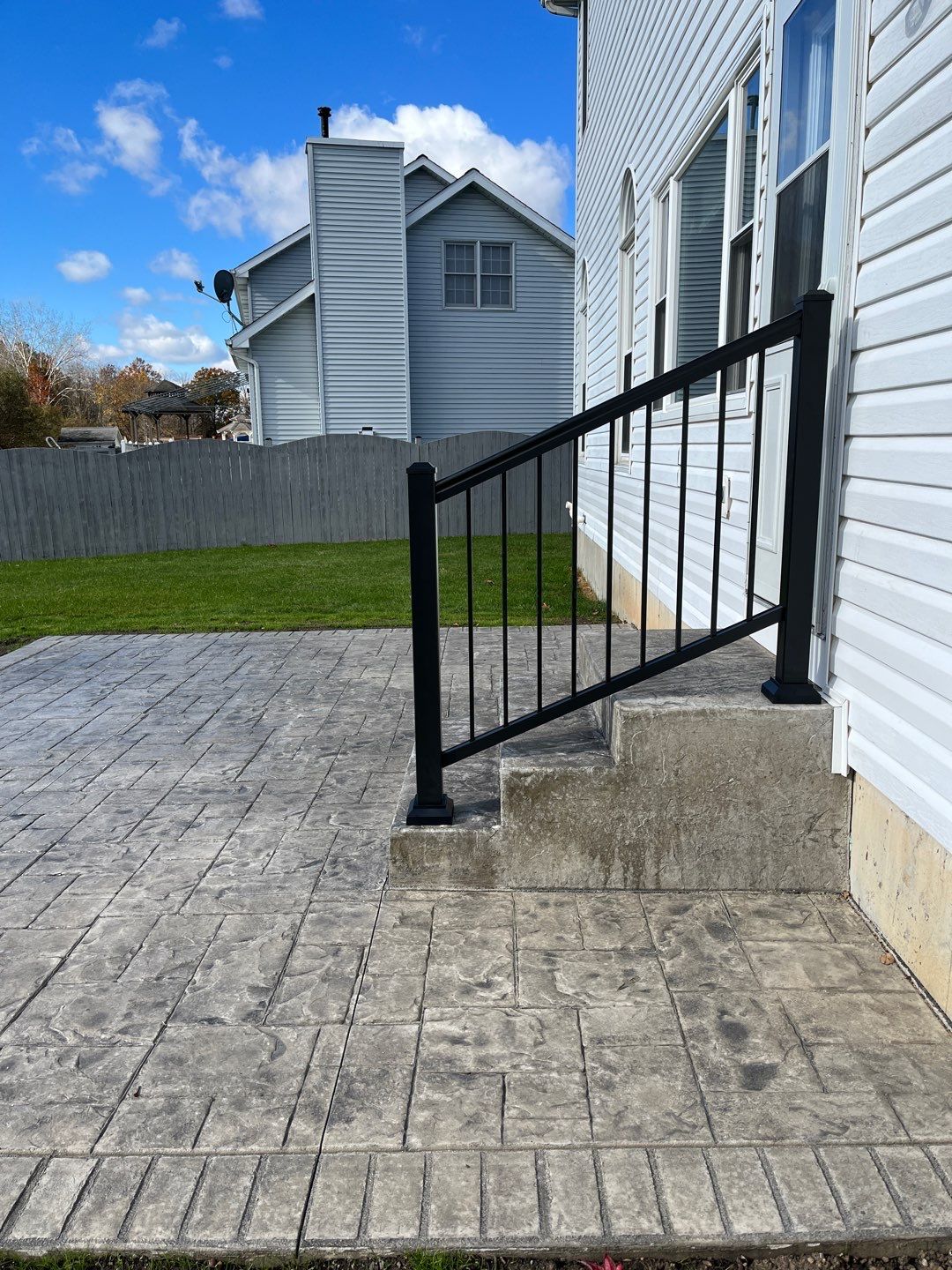 Stamped Concrete and Entry Door by Ivy Lea Construction