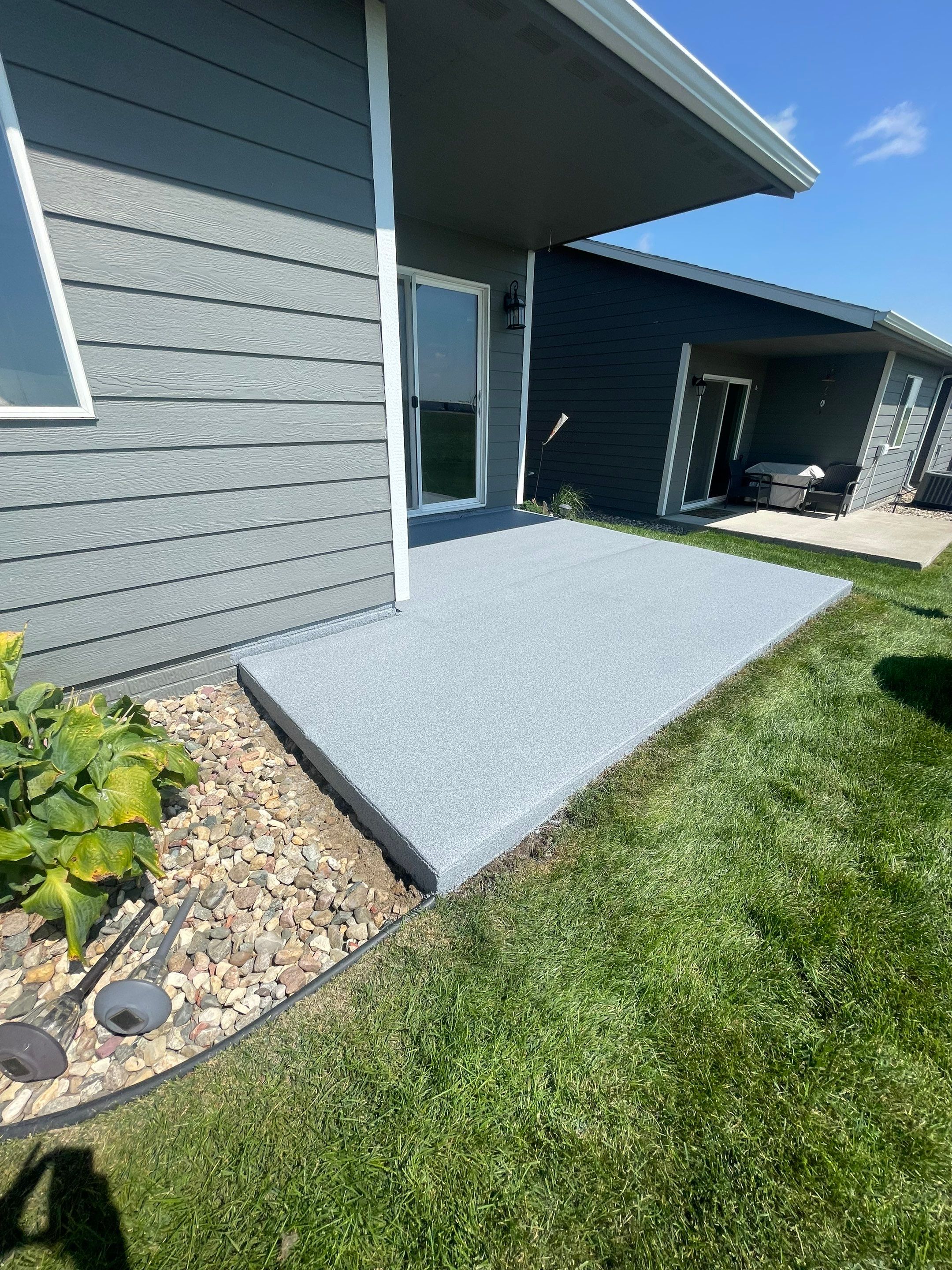 Starry Evening Concrete Patio Coating Installation in Tea by Select Painting, Coatings & Garage Cabinets