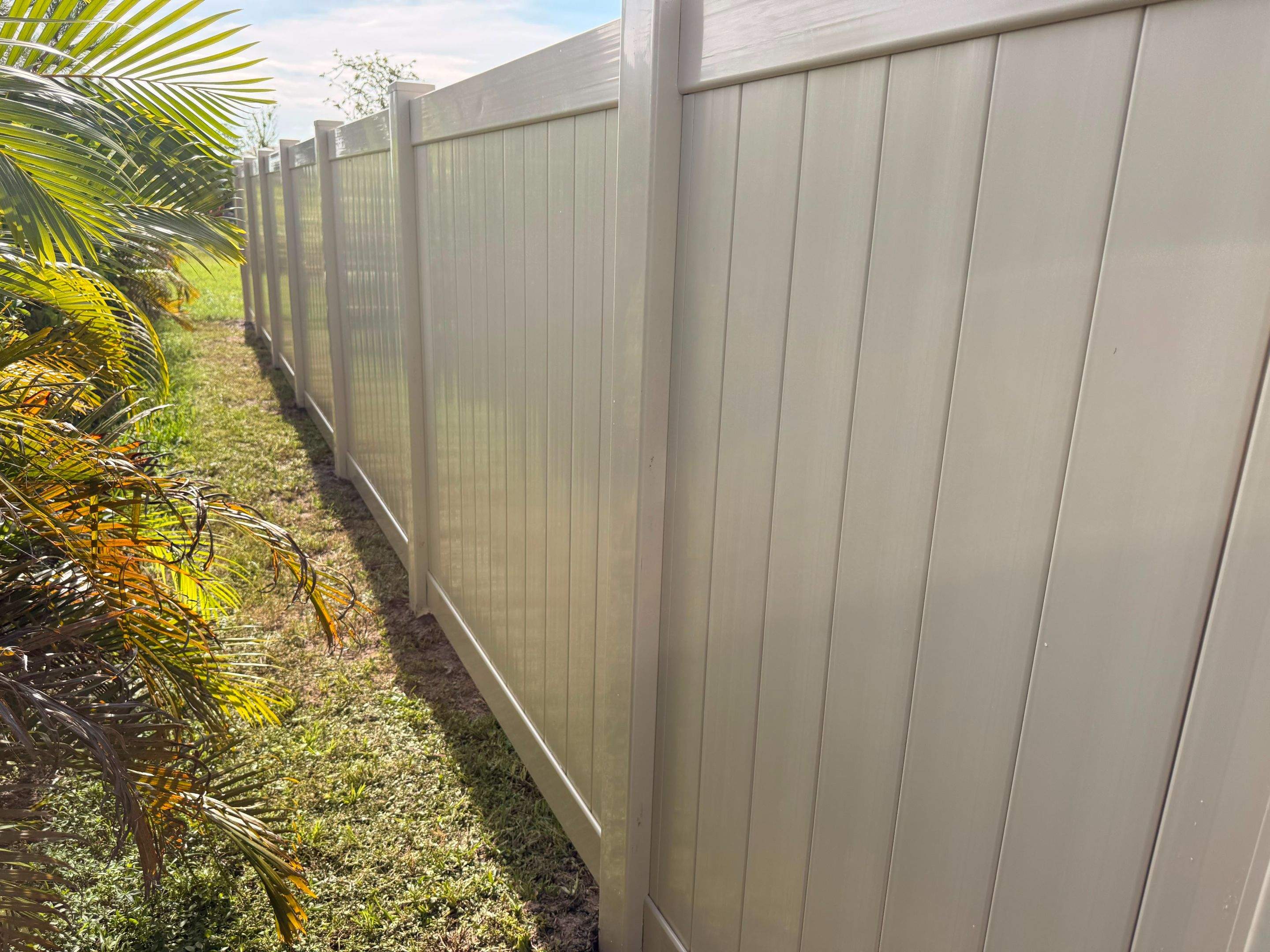 Residential Tan Vinyl Privacy Fence Installation in Nokomis by True Fence LLC