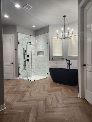 Spring Bathroom Remodel with Black Free-Standing Tub and Walk-In Shower