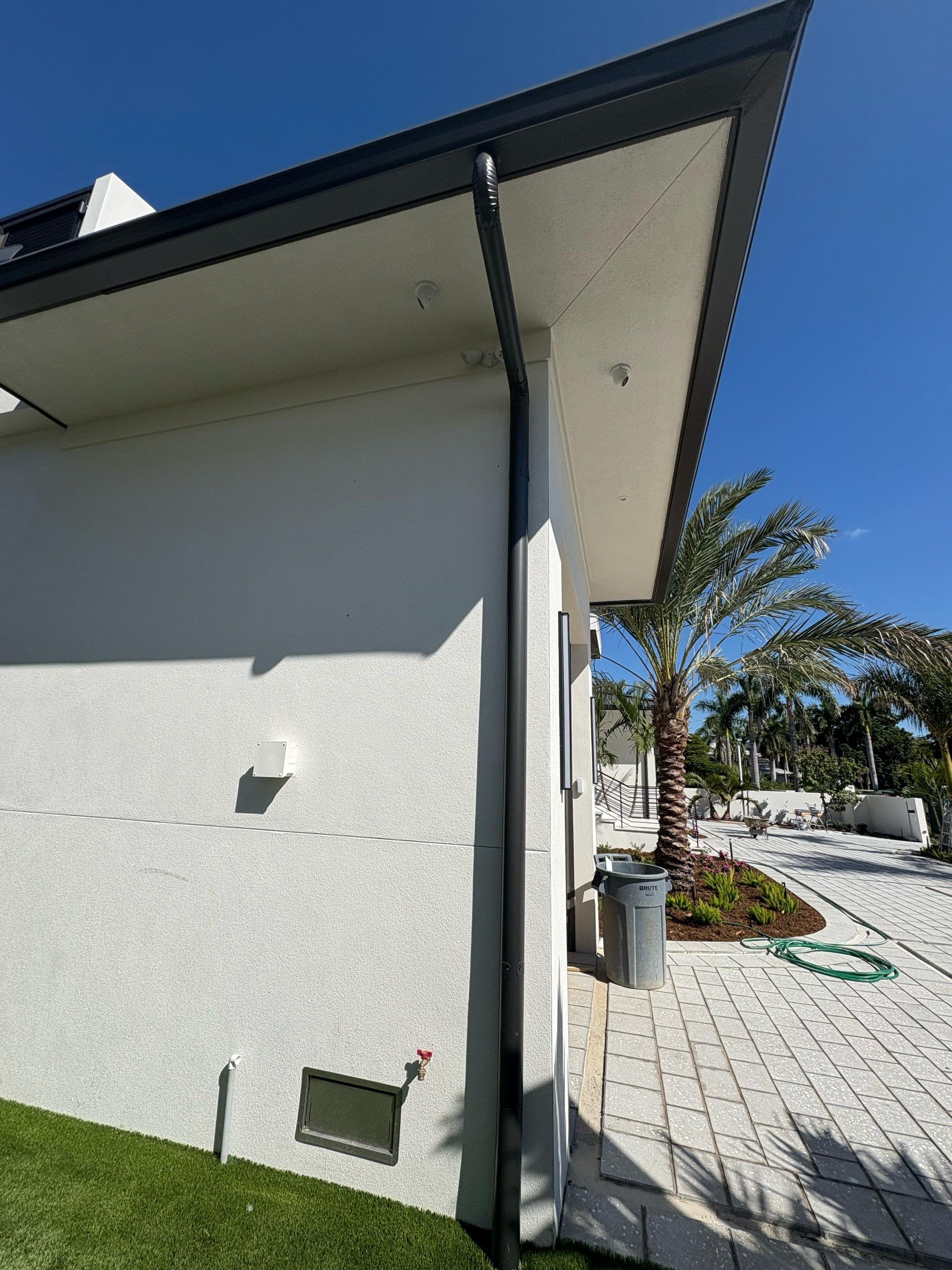 Seamless Aluminum Gutter Installation using black seamless gutters in Sarasota FL by Gutter Professors