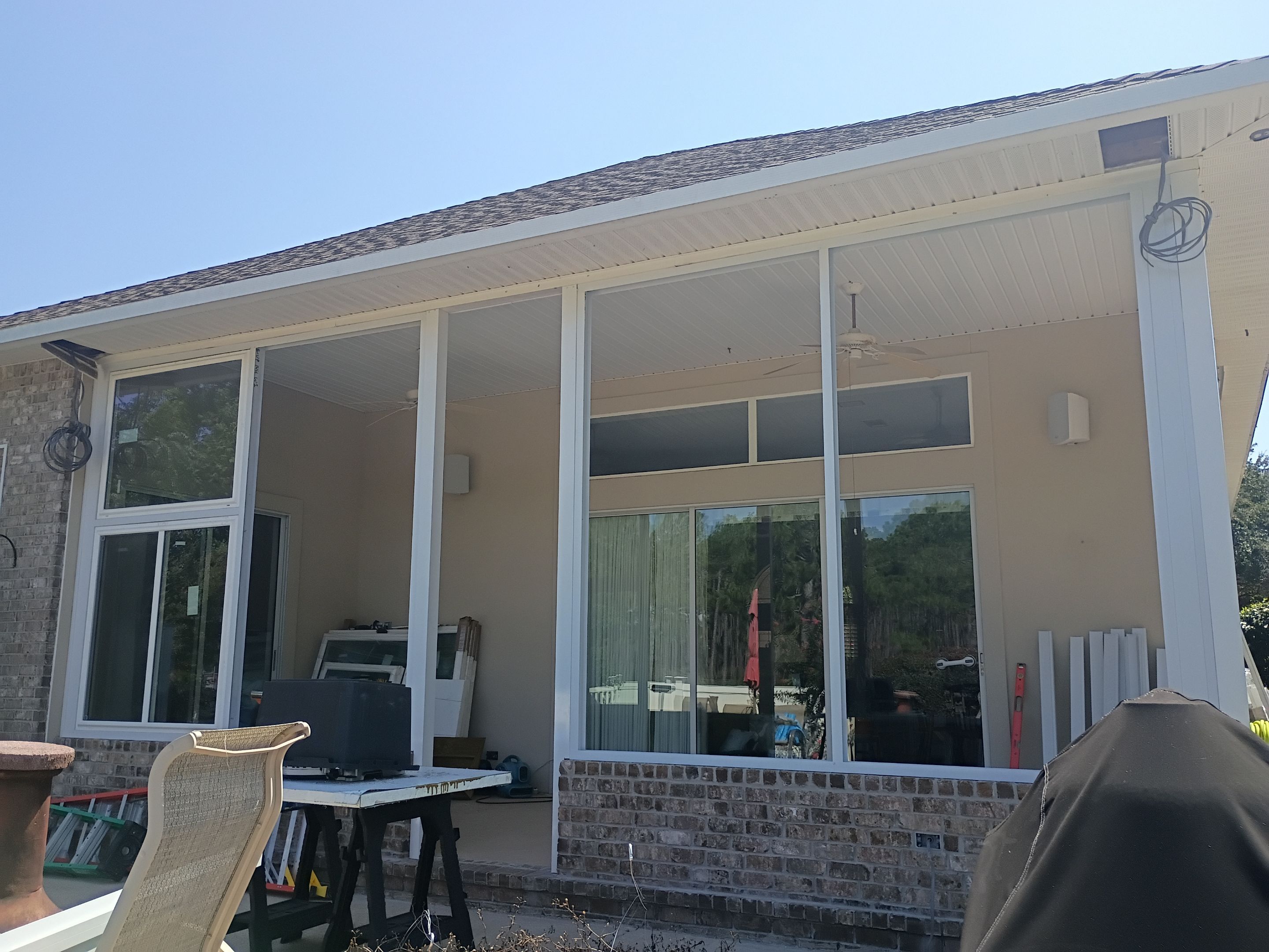 Screen Room Conversion to Glass Under  by Titan Sunrooms