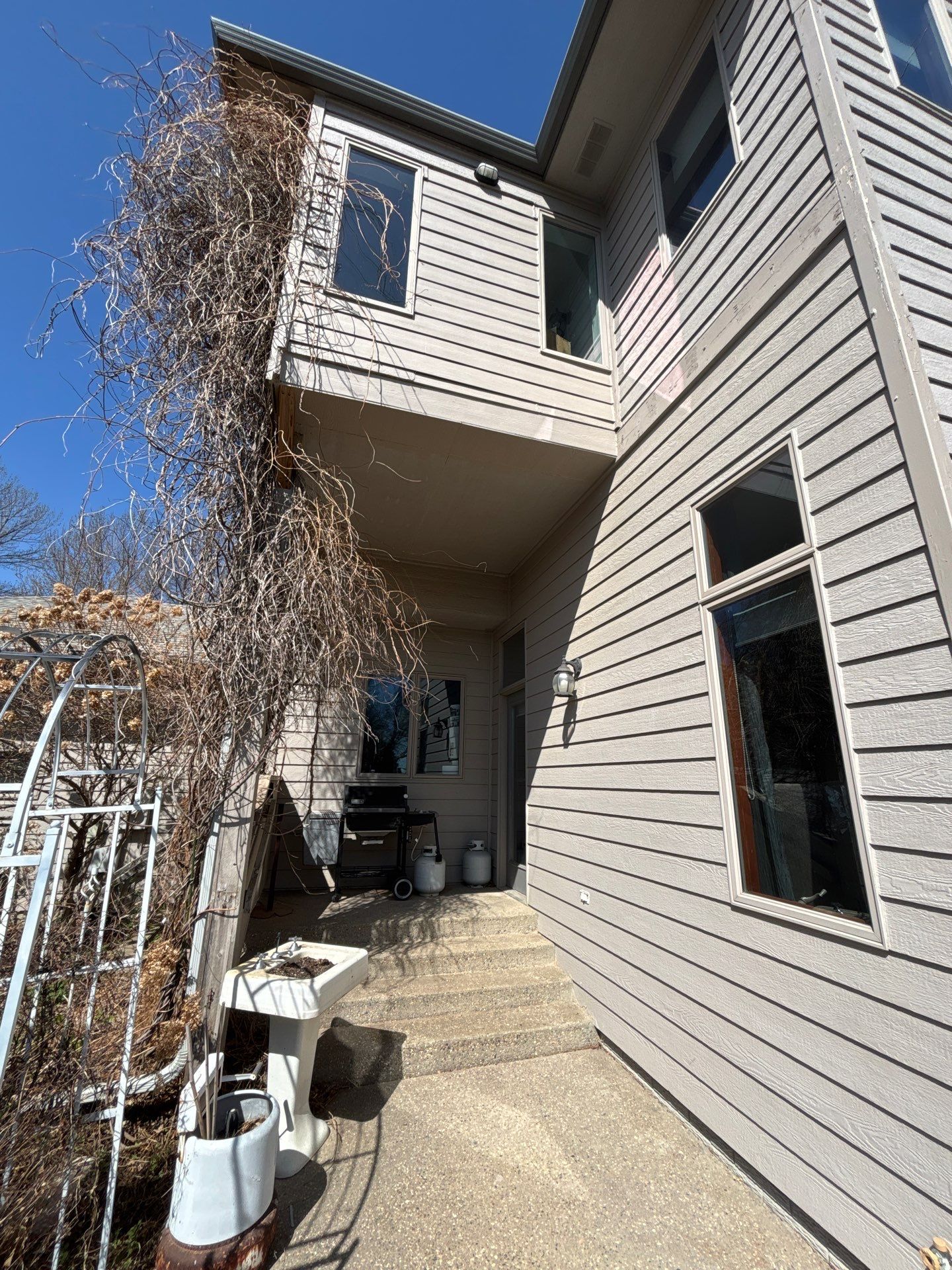 Exterior Siding and Trim Painting for Sioux Falls Residence by Select Painting, Coatings & Garage Cabinets