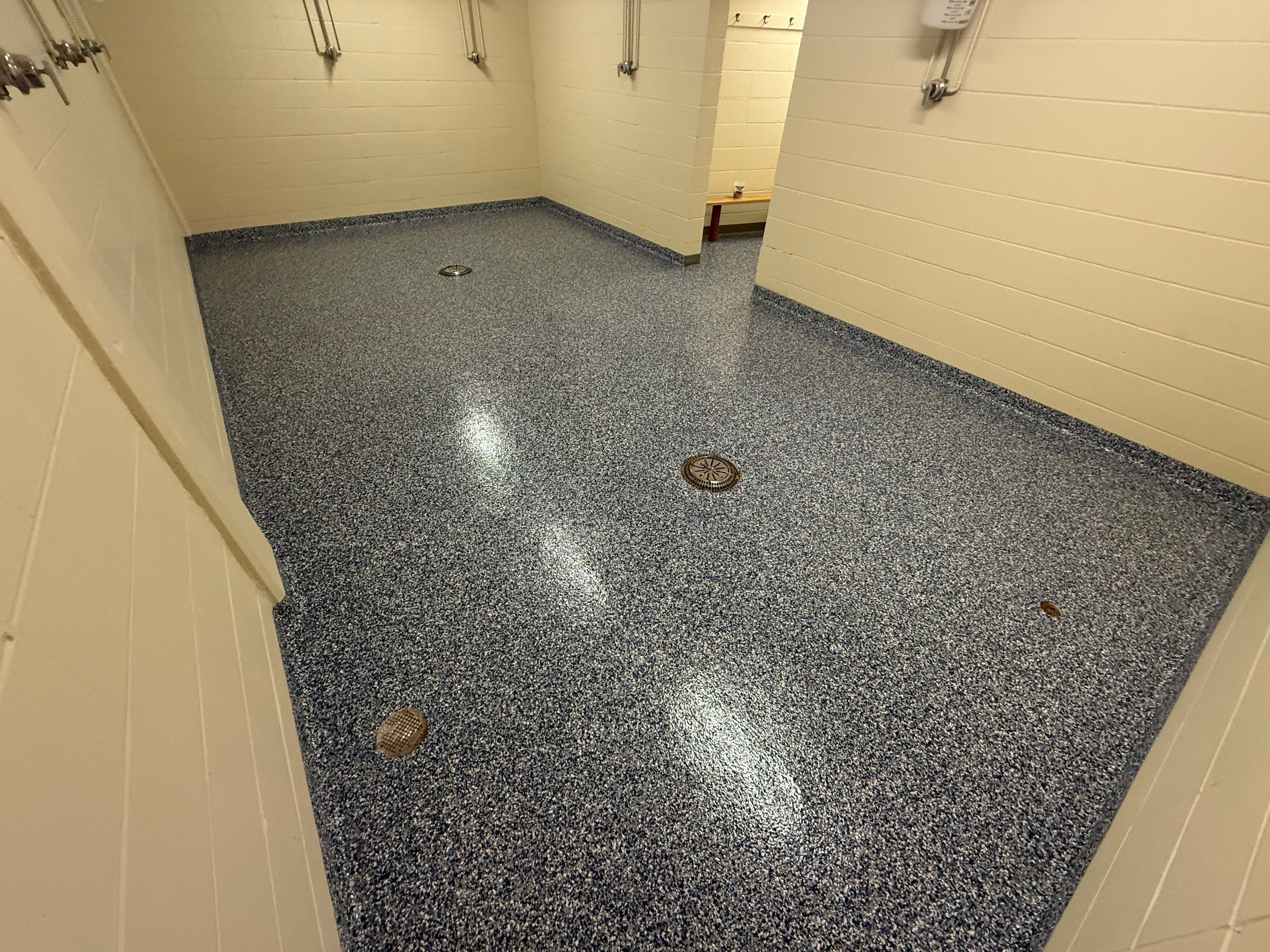 Seamless Epoxy Floor Coating at the Sioux Falls Canaries Facility by Select Painting, Coatings & Garage Cabinets