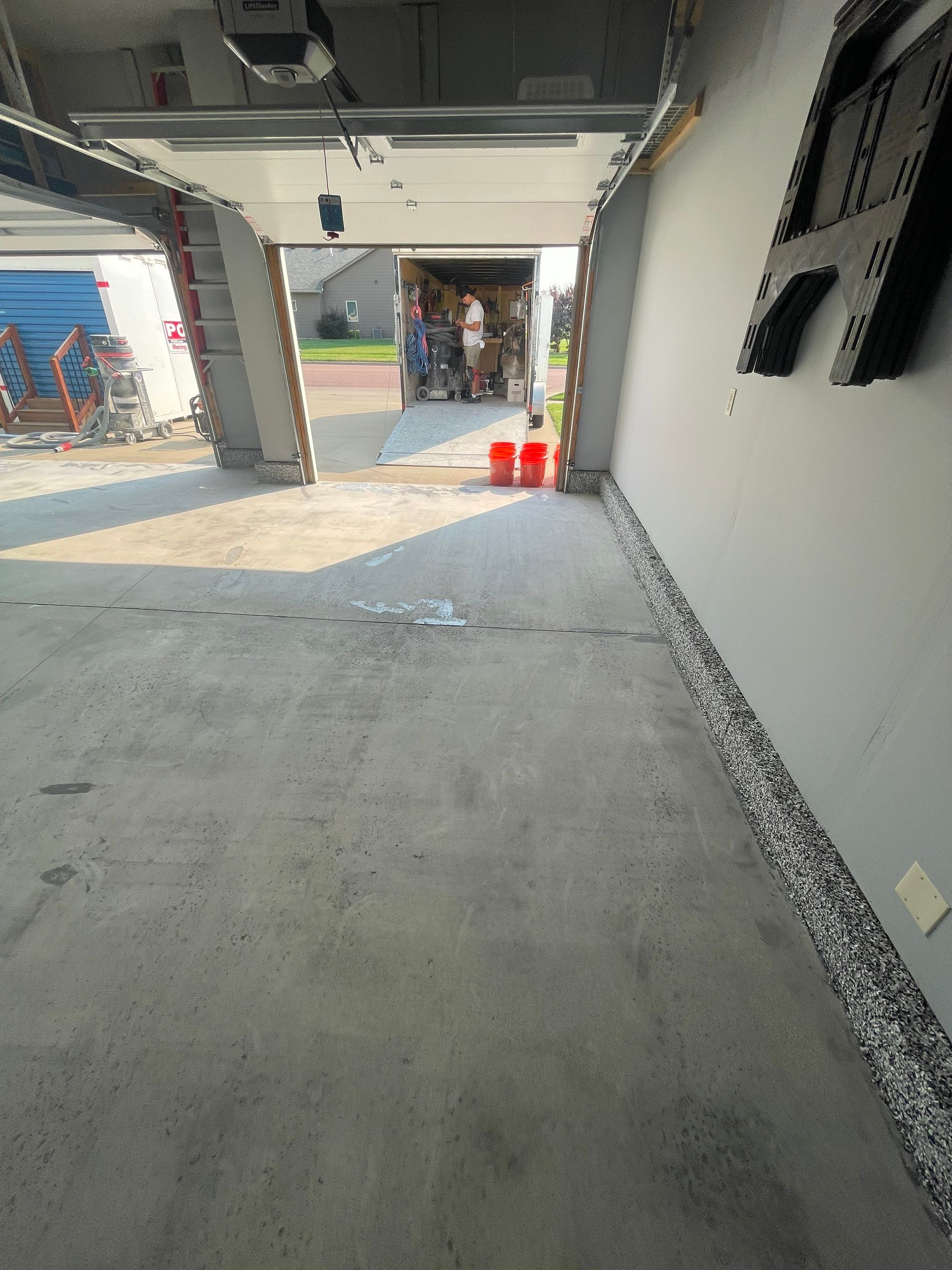 Sioux Falls Garage Concrete Coating Installation with Domino Flake by Select Painting, Coatings & Garage Cabinets