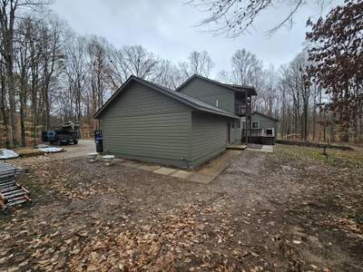 Siding Installation using Primed James Hardie & Straight Edge Shakes