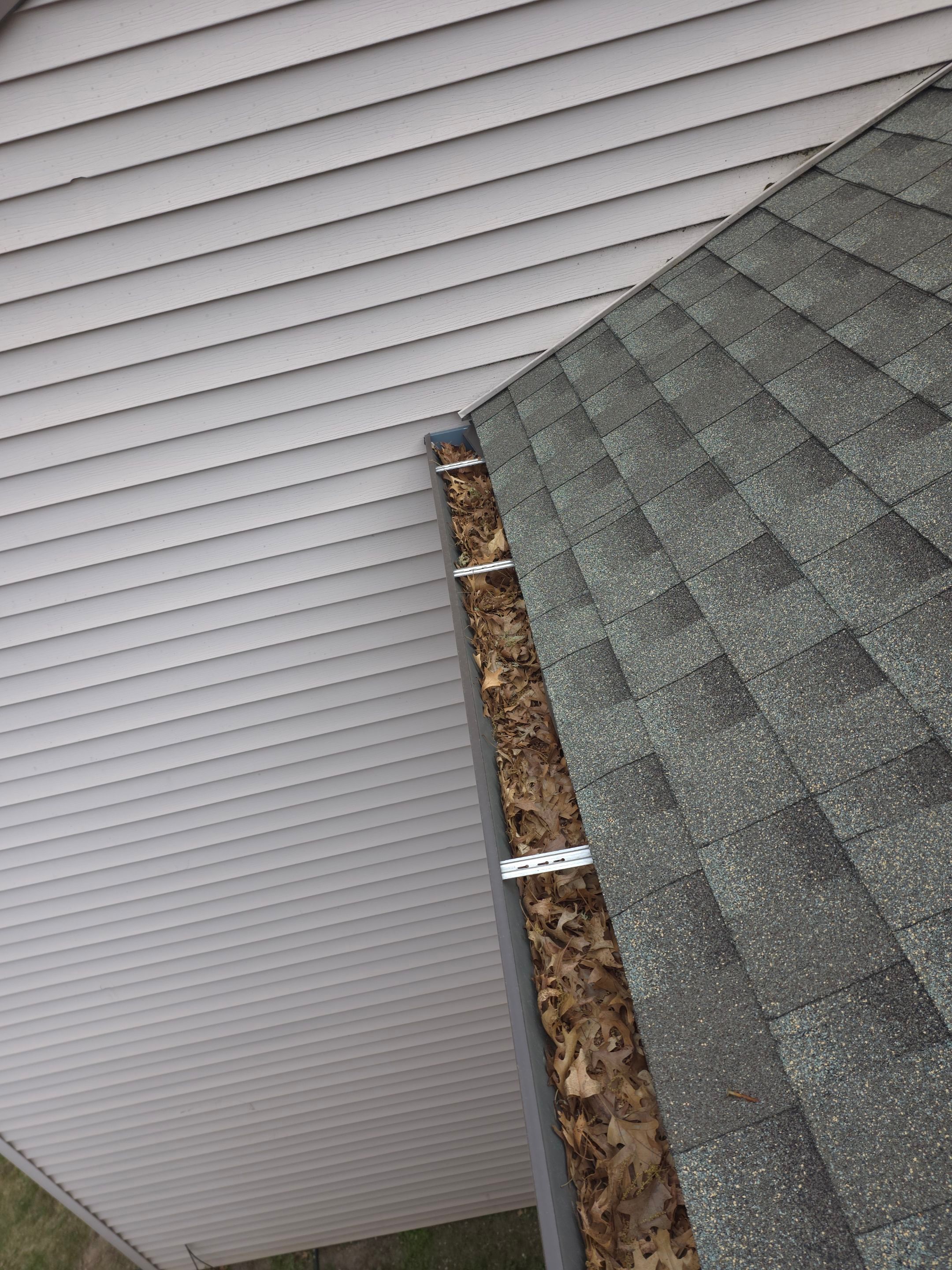 Commercial gutter cleaning Eau Claire before photo with filled gutters